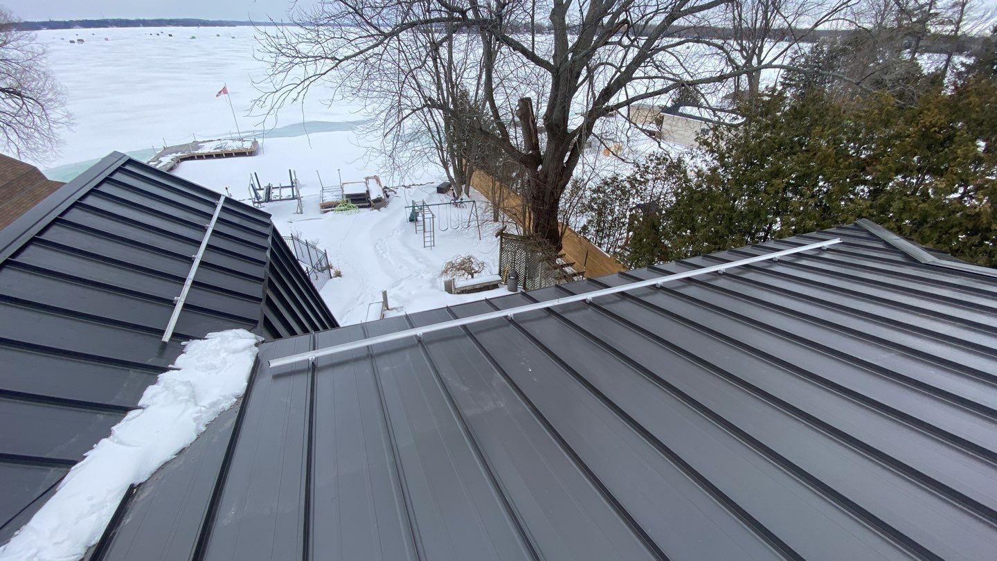 Residential Roofing Installation using 16" Standing Seam Panels by Jay Carter Roofing & Sheet Metal