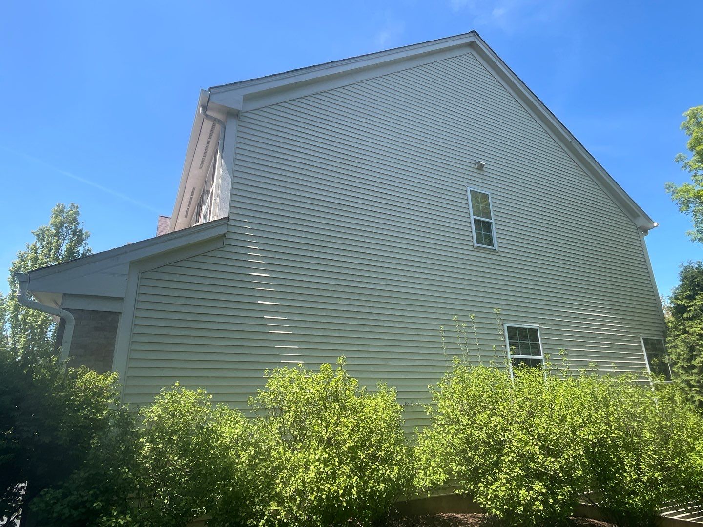Housewashing  using Algaecide, soft wash soap by Northern Power Washing LLC.