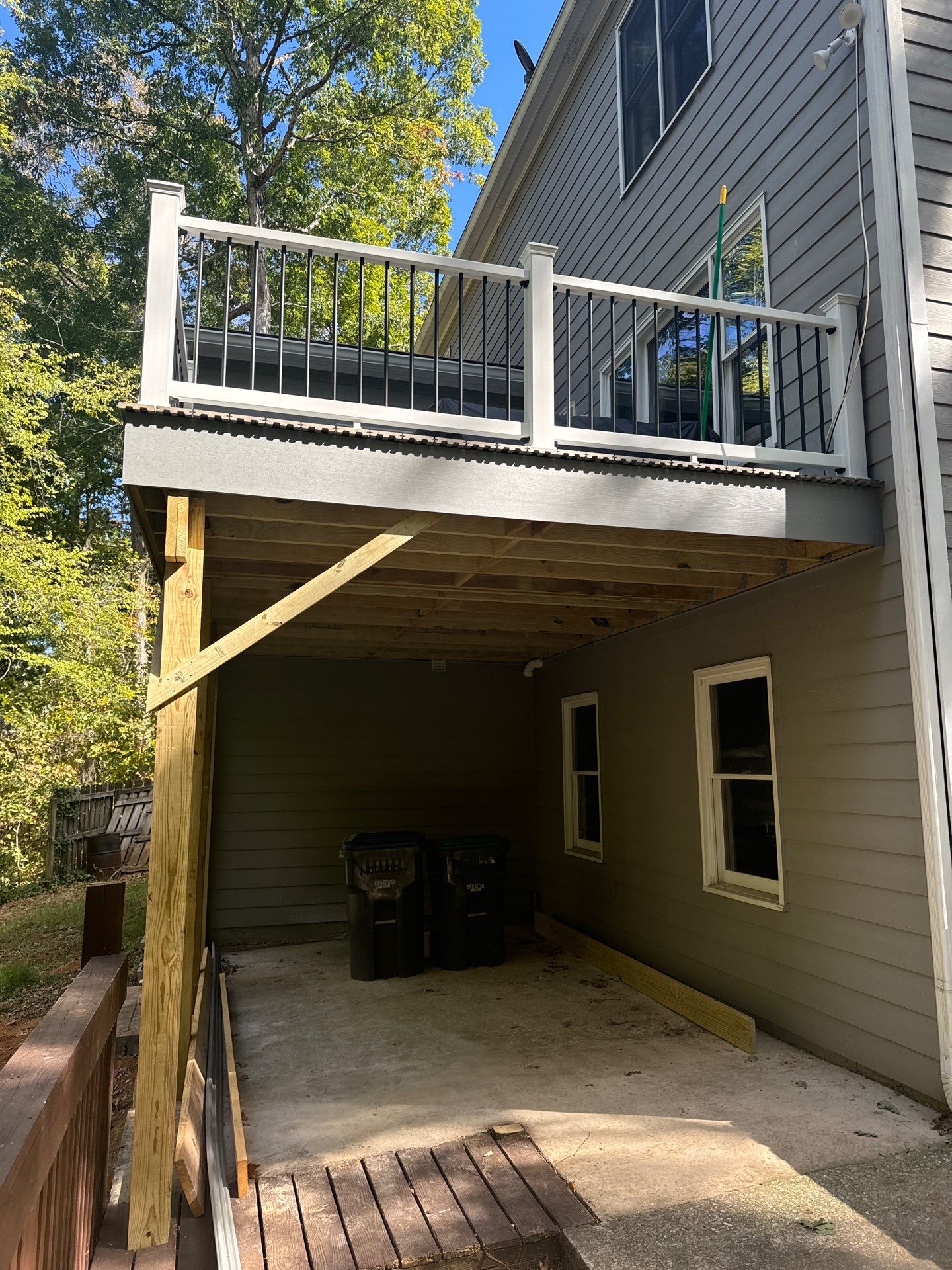Elevated Deck Replacement with White Railings in Kennesaw by Swift Home Renovations 