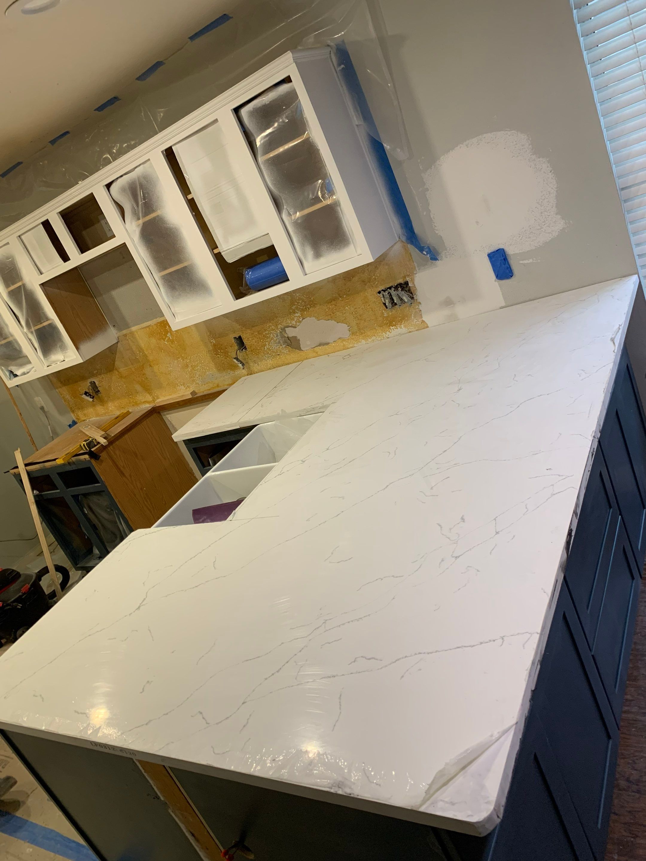 Modern Kitchen Remodel with Blue Cabinetry by Majesty Construction