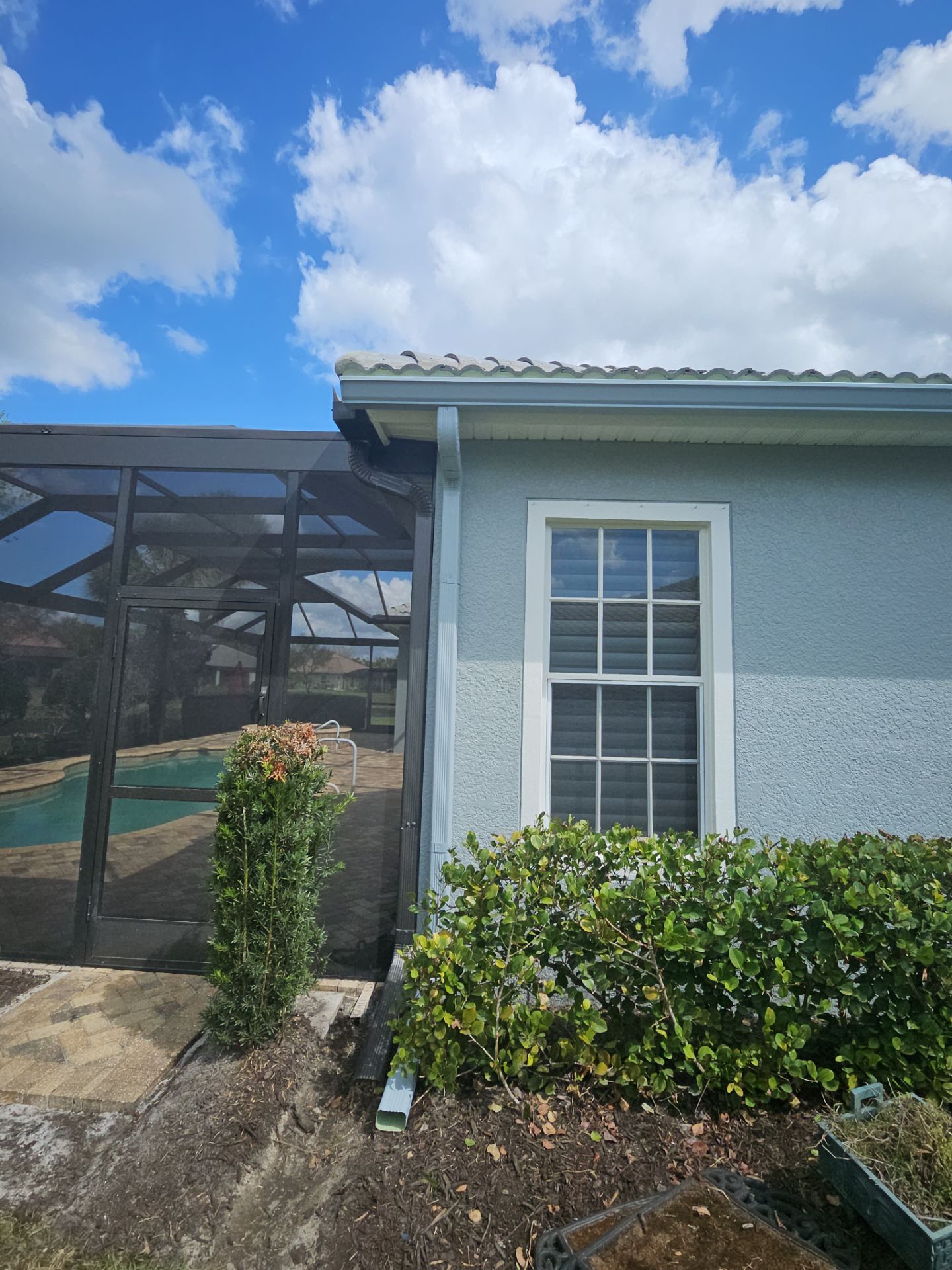 6-inch K-style Seamless Gutters and Splash Guard in Grey Color in Naples FL by Gutter Professors