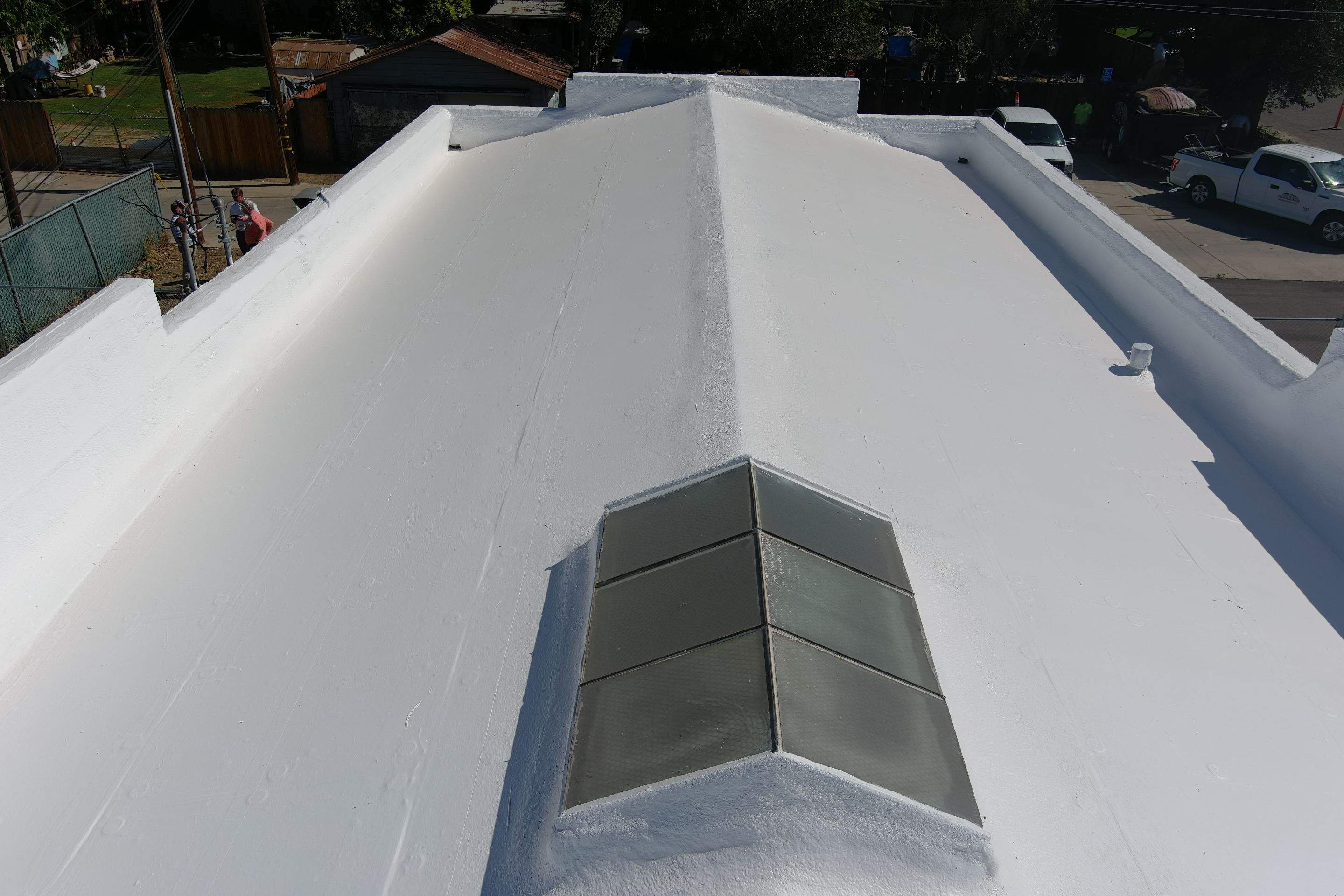 Commercial Roofing Installation using Conklin BenchPly system with PUMA top coat (imbedded fabric system) by Straight Edge Roofing Inc