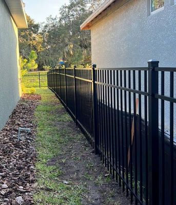 Aluminum Fence Installation using Black 3 Rail Aluminum Fence