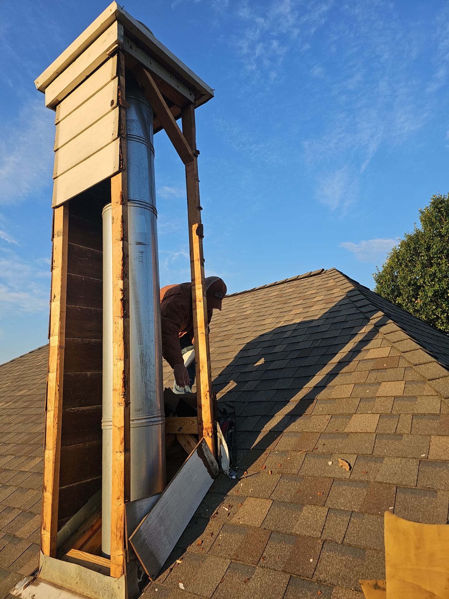 chimney repair using lap engineered treated composite siding. by road roofing llc