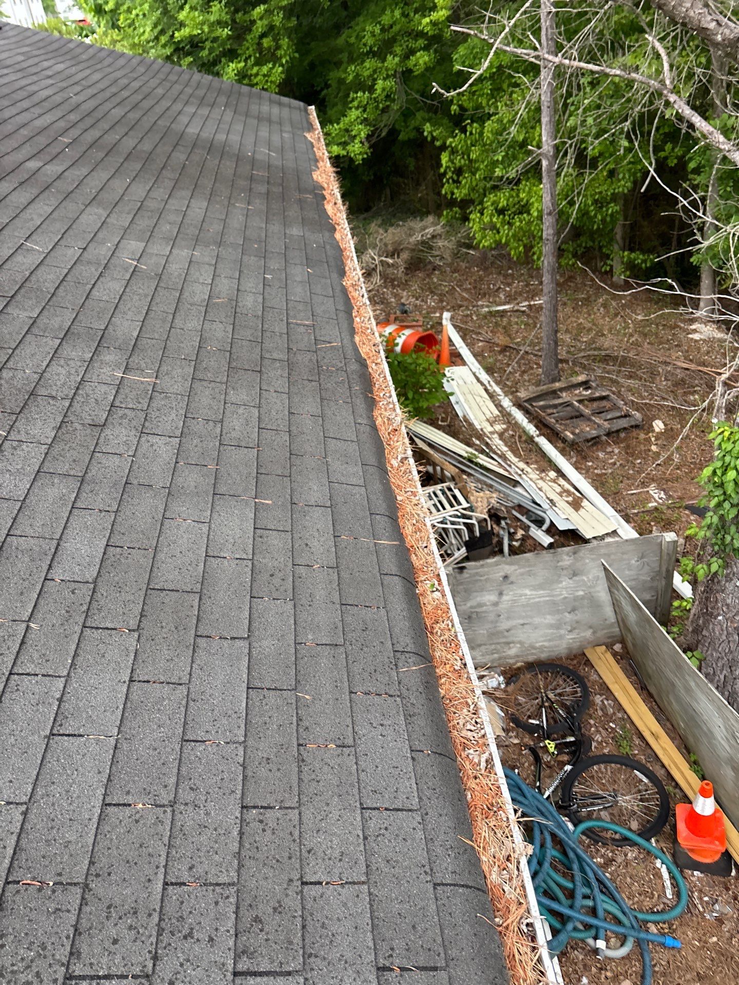 Commercial gutter cleaning Tuscaloosa before photo with filled gutters