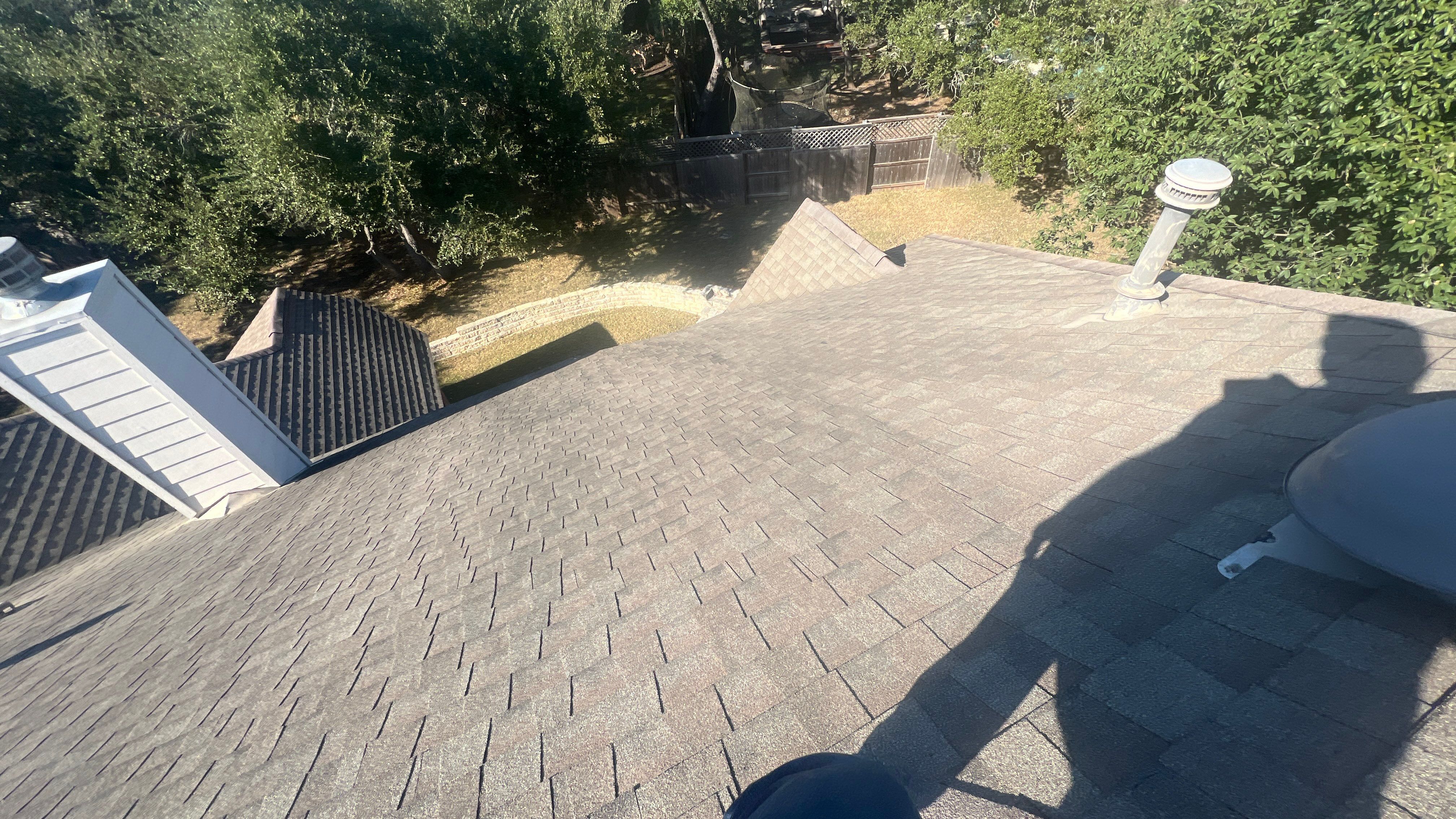 Asphalt Shingle Roof Replacement and Storm Damage Restoration in Austin by Caliber Restoration LLC