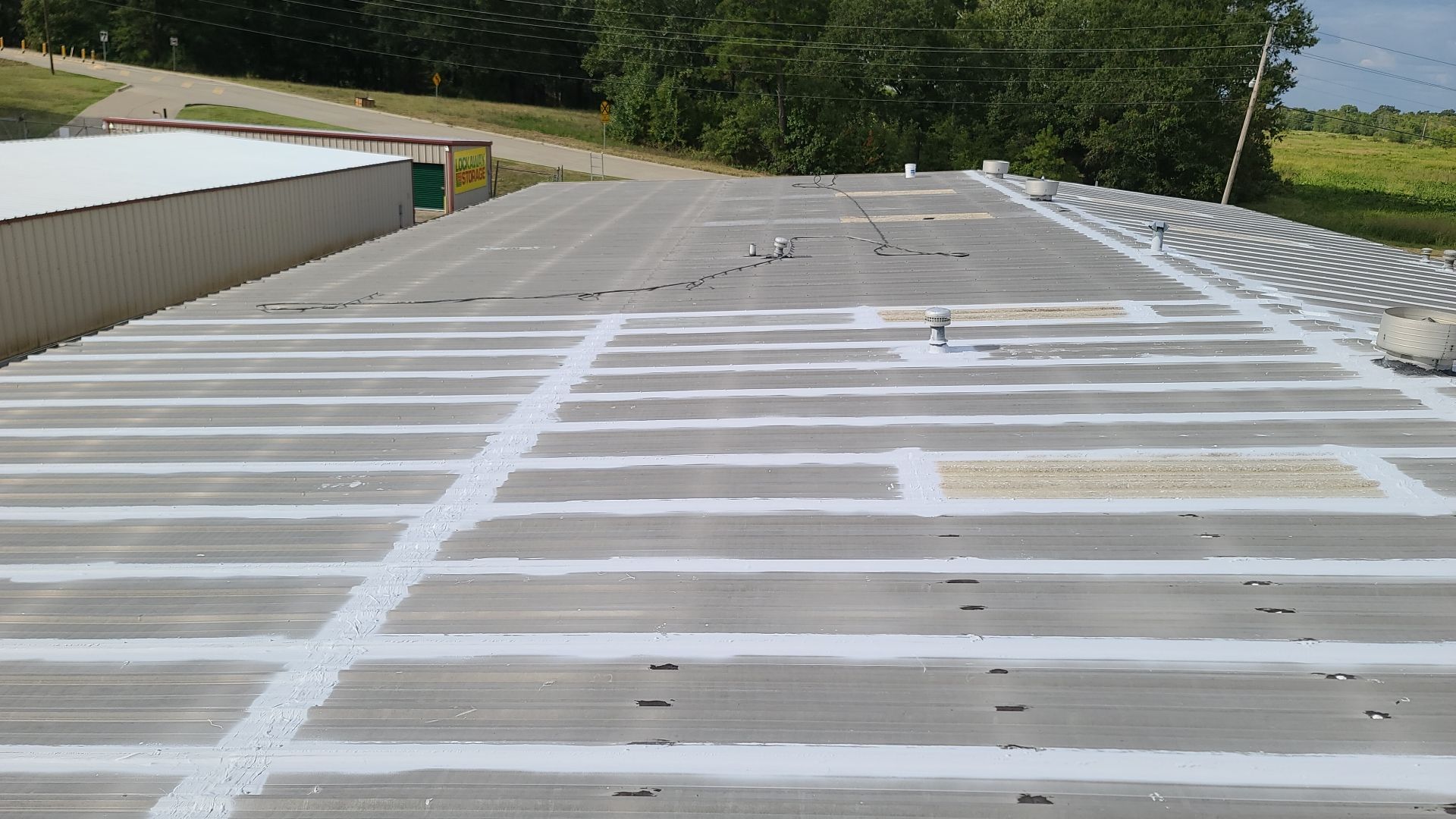 Commercial Metal Restoration System using Aldocoat Coatings by Hostetler Roofing