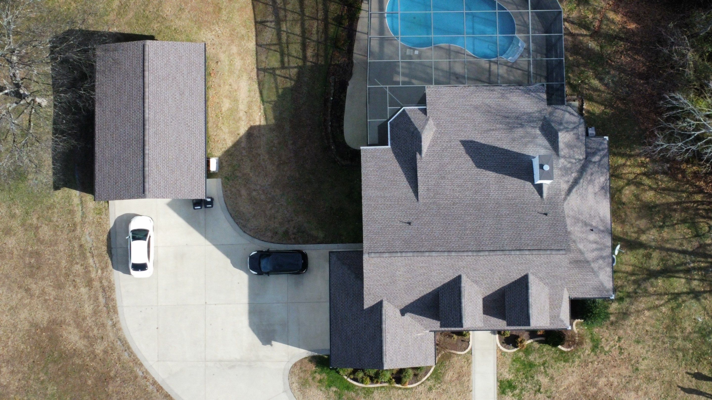 Roof and Gutter System Replacement with Stone Chimney Rebuild by Undersun Roofing 