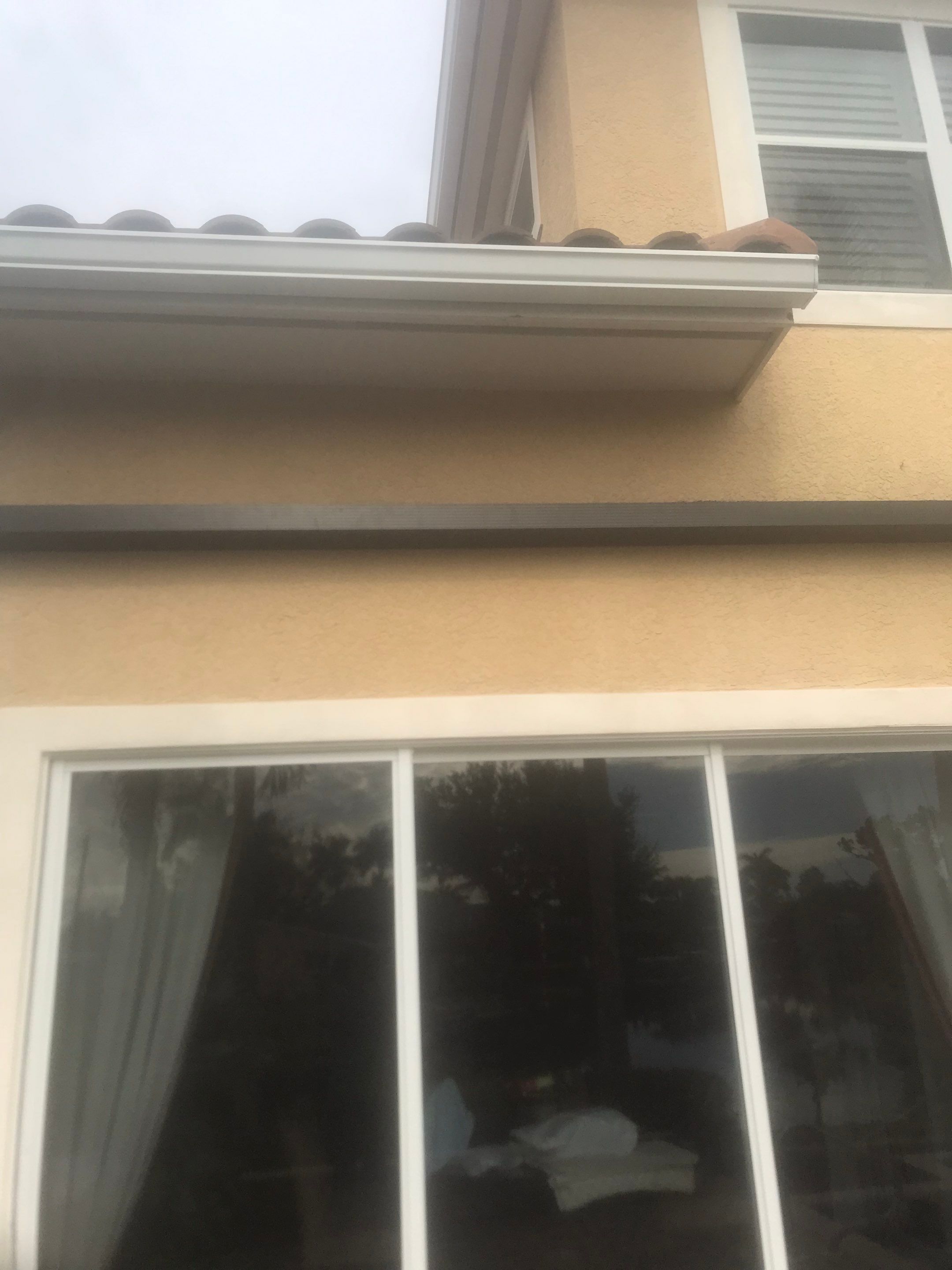 6 Inch Seamless Gutters using White Gutters and Downspouts in Fort Myers FL by Gutter Professors