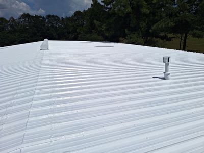 Commercial Metal Roof Restoration with White Protective Coating