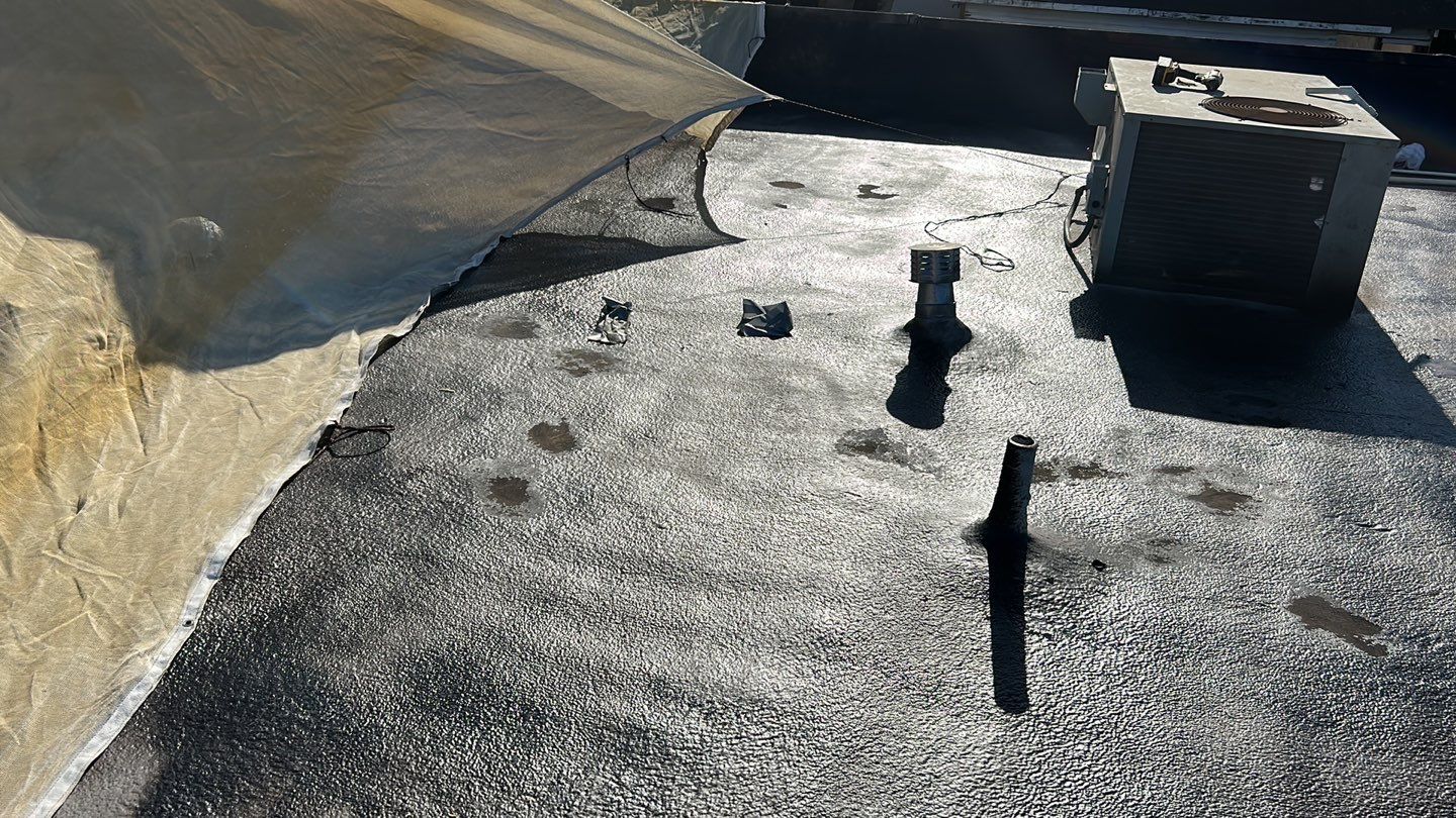 Foam Refurbish using Conklin Benchmark/PUMA XL coatings and spray foam; Also metal roofing around parapet wall by Straight Edge Roofing Inc