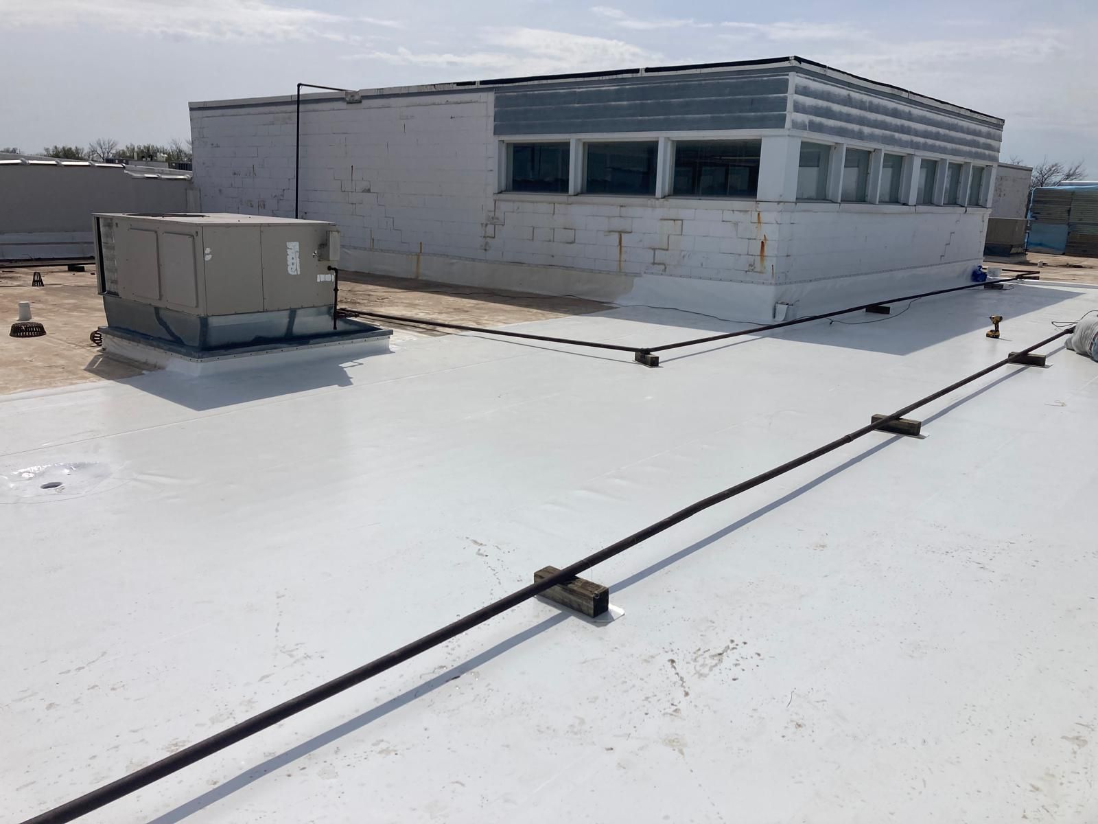 Full Roof Tear-off with new Code ISO insulation and 50 Mil Membrane by Grell Roofing, LLC