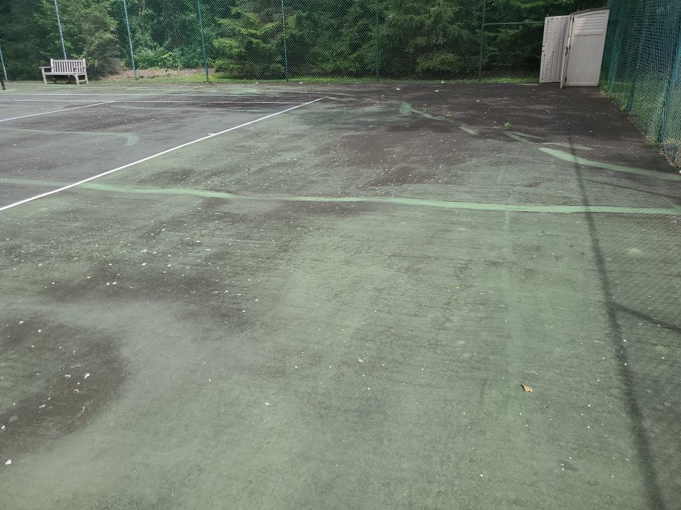 Tennis court cleaning by Northern Power Washing LLC.