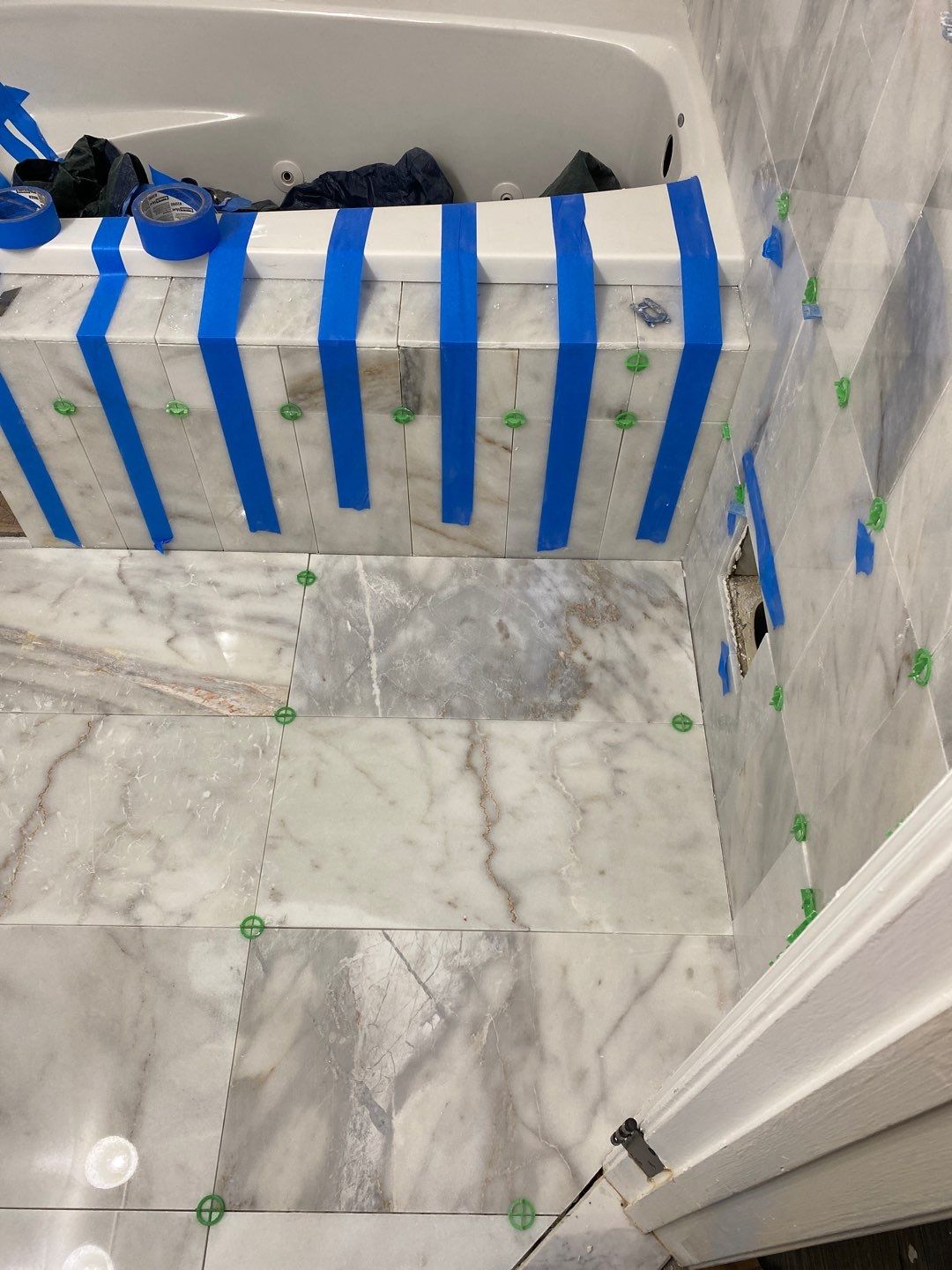 Bathroom Remodel using Two new bathroom design and new floors by Alpha Design Services