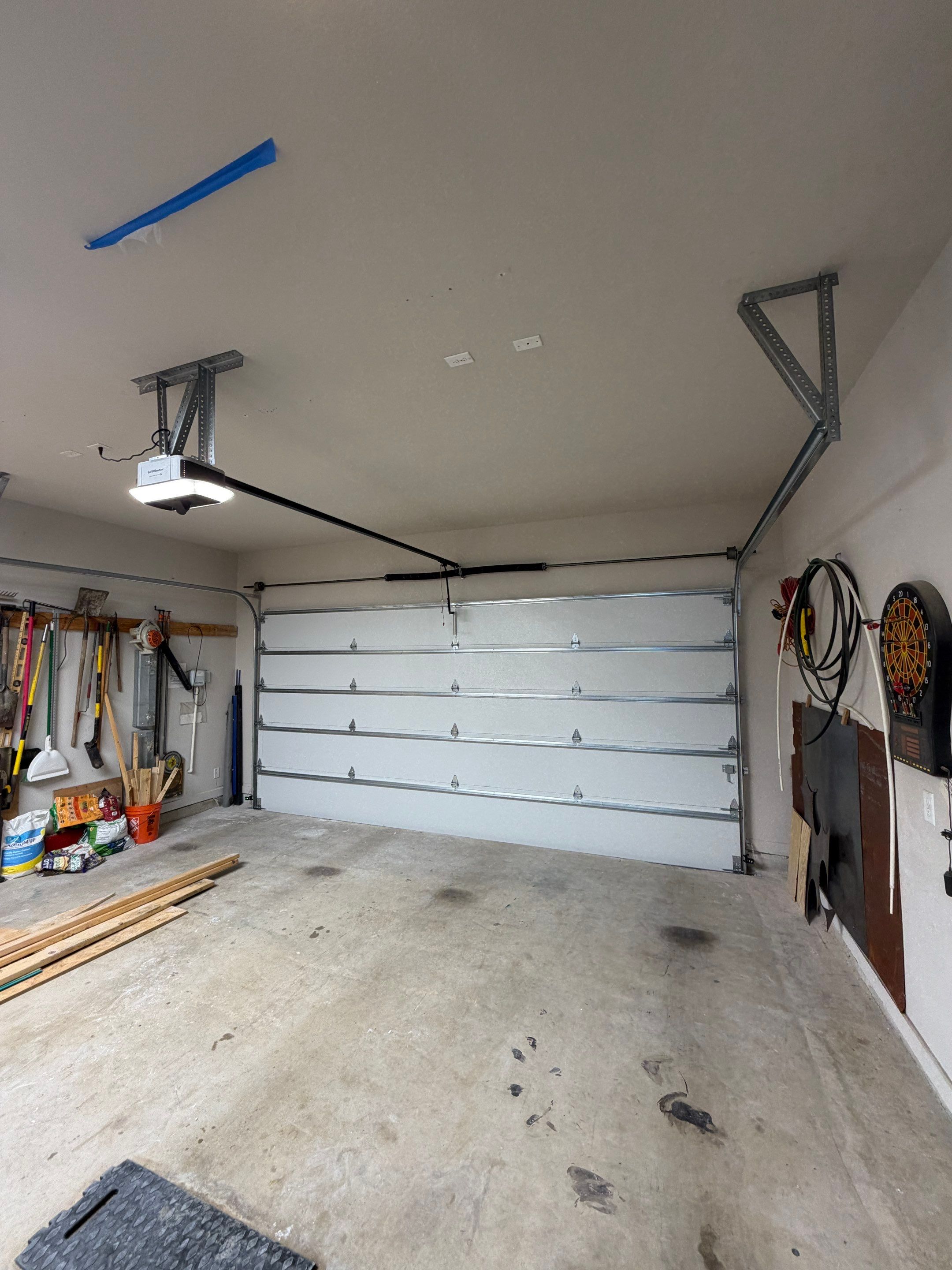 Garage Door Center Post Conversion in Aubrey, Texas by Meadows Garage Doors