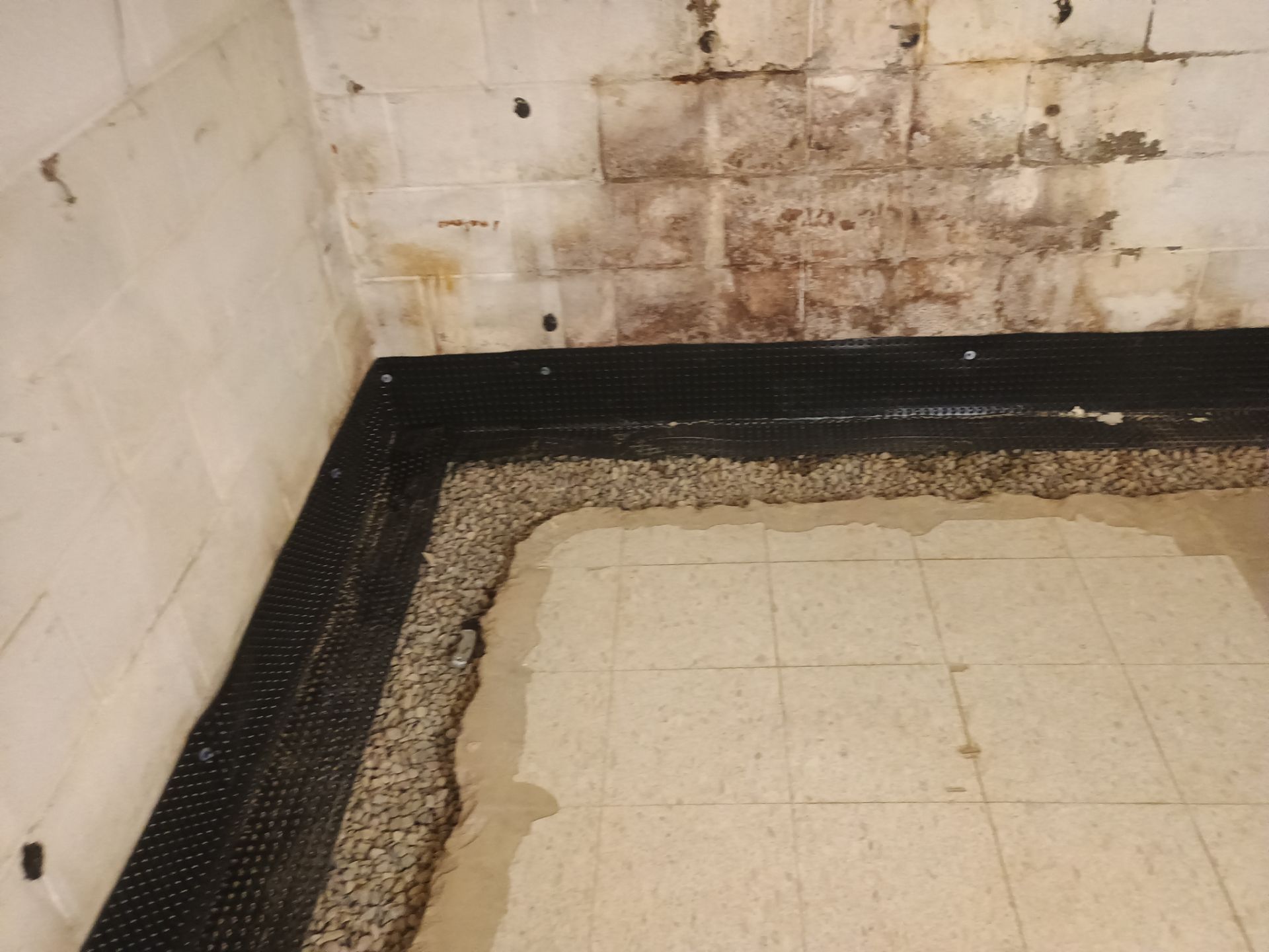 Interior Drain Tile Installation in Columbia Heights, MN by Waterproofing Northeast