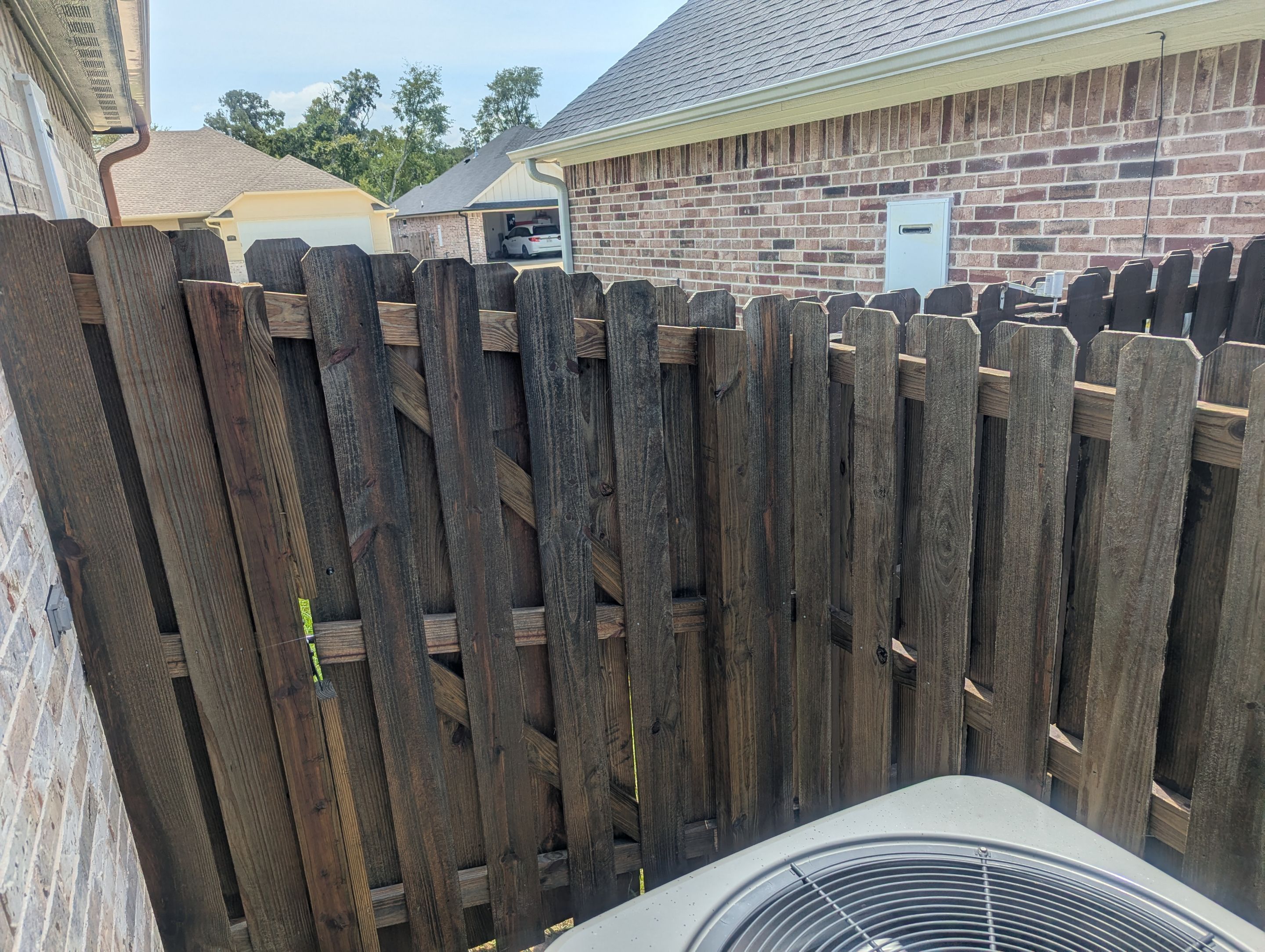 Touching Up a Fence in Whitehouse by Quality Coats Painting