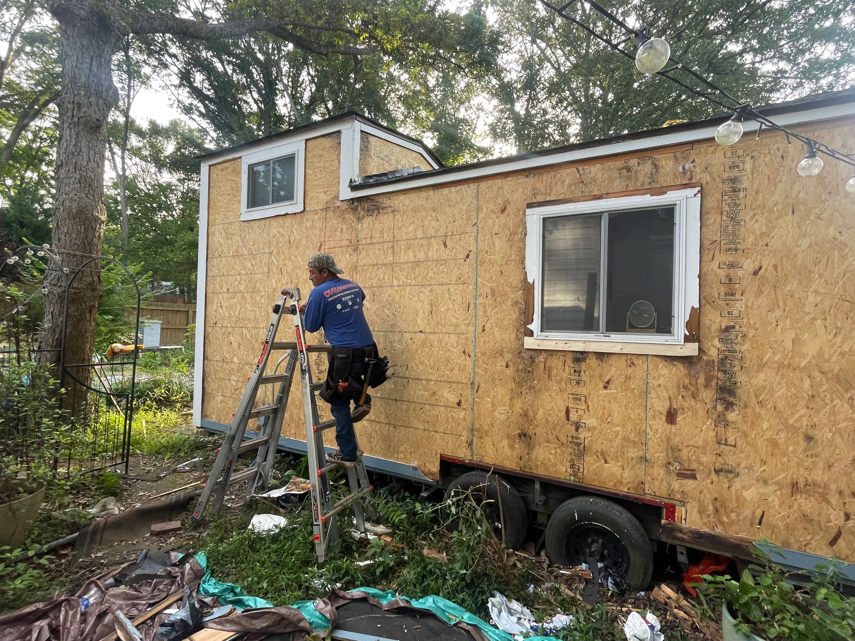 tiny home remodel- siding,paint,roofing by Nailed It Roofing & Remodeling LLC