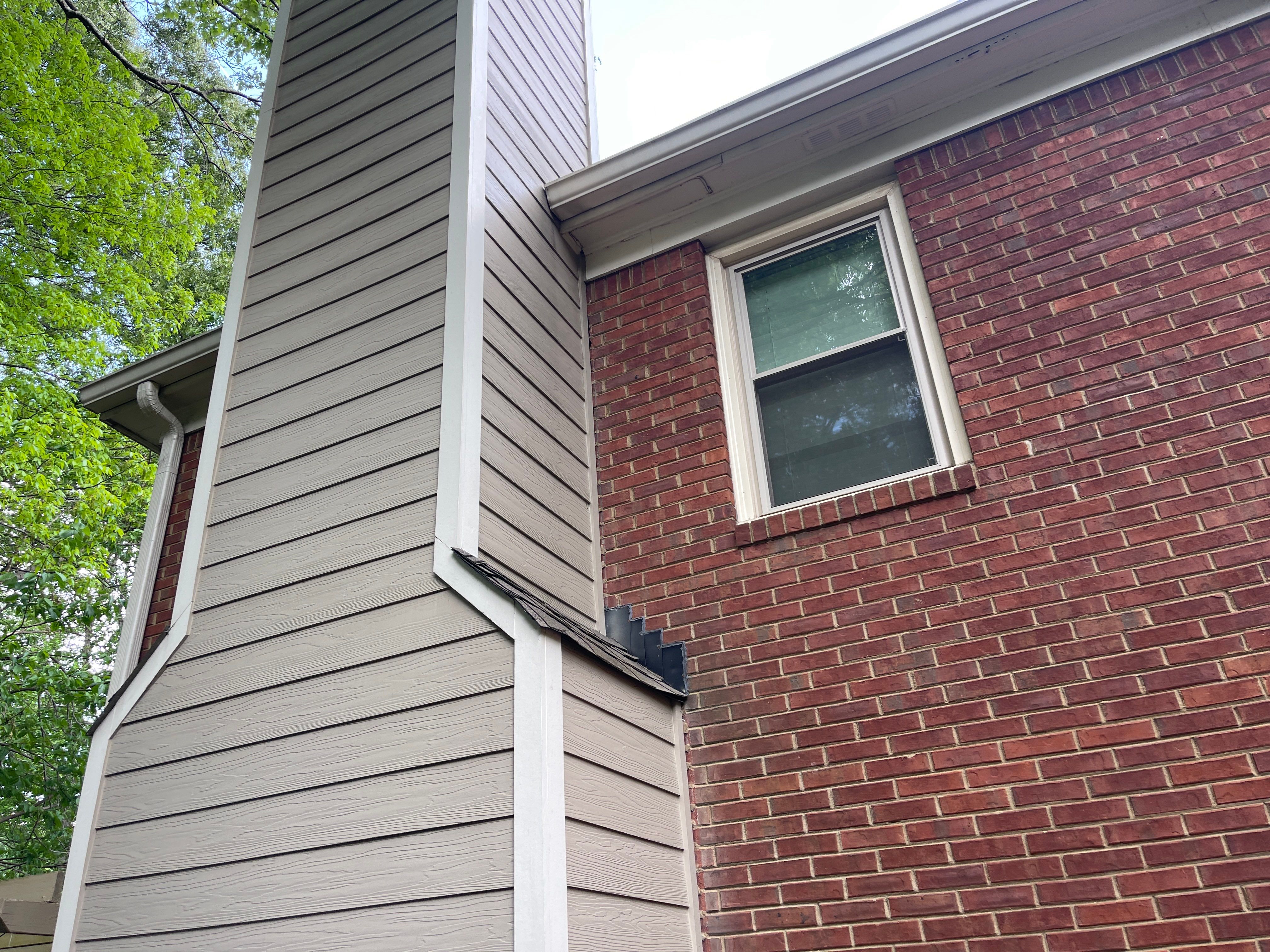 Marietta, GA Rotten Wood Replacement, Chimney Corner Board Installation, Gutter Replacement, and Exterior Painting by Nelson Exteriors