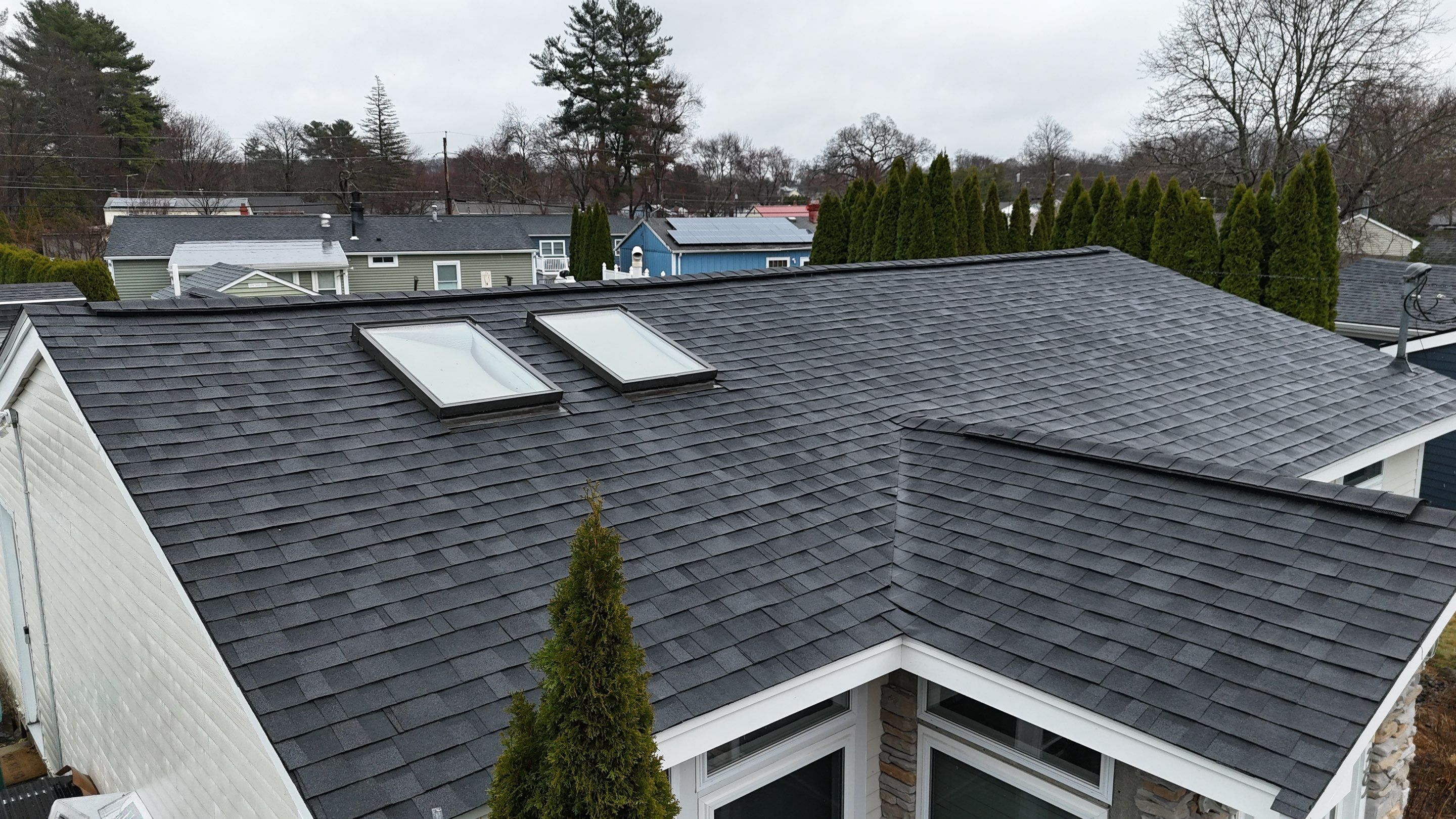 Full Roof Replacement & Complete PVC Trim System in Lowell, MA by Mighty Dog Roofing of Greater Middlesex County