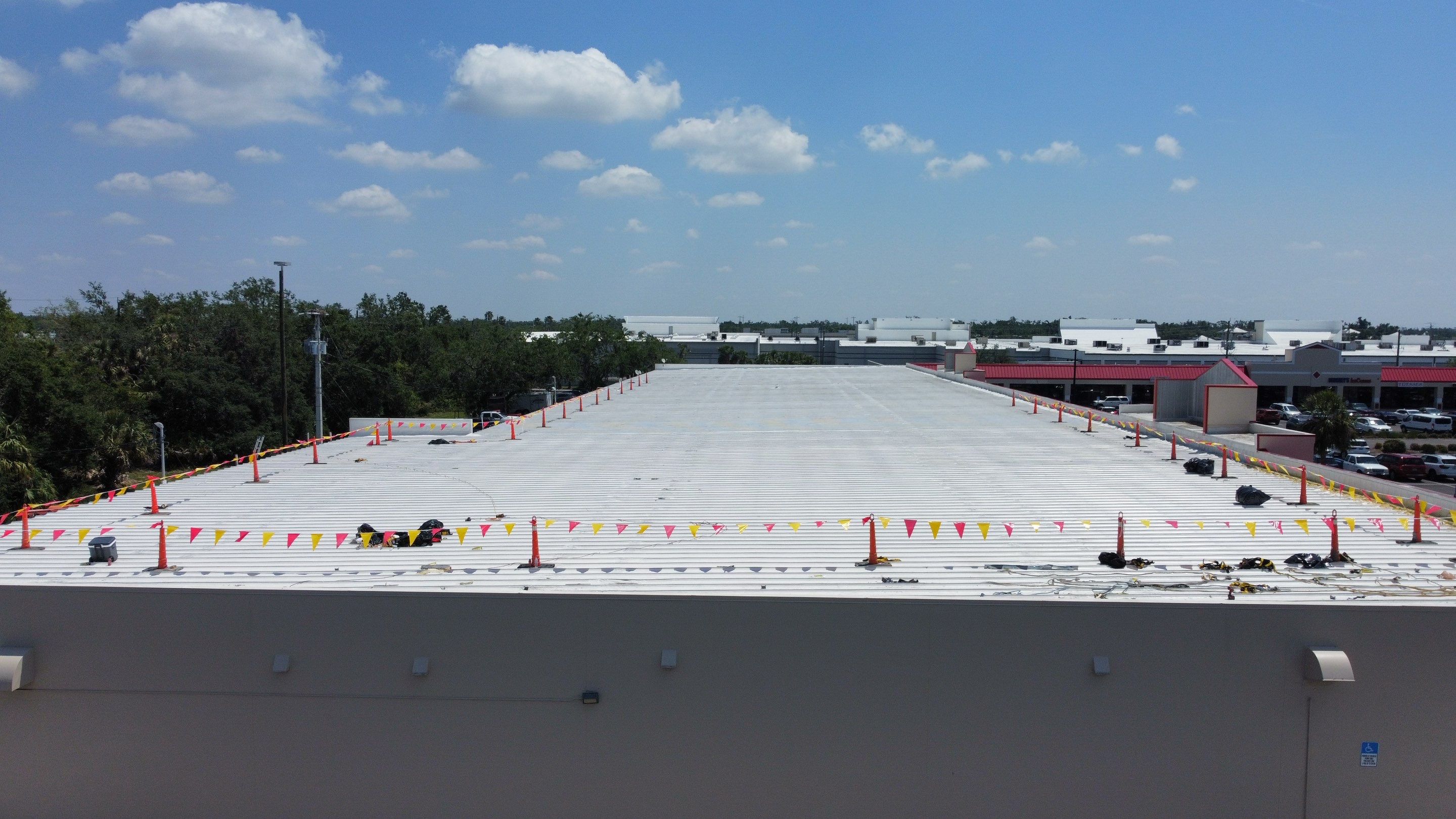 Commercial Metal Roof Replacement at Shopping Plaza in Port Charlotte by CES Roofing
