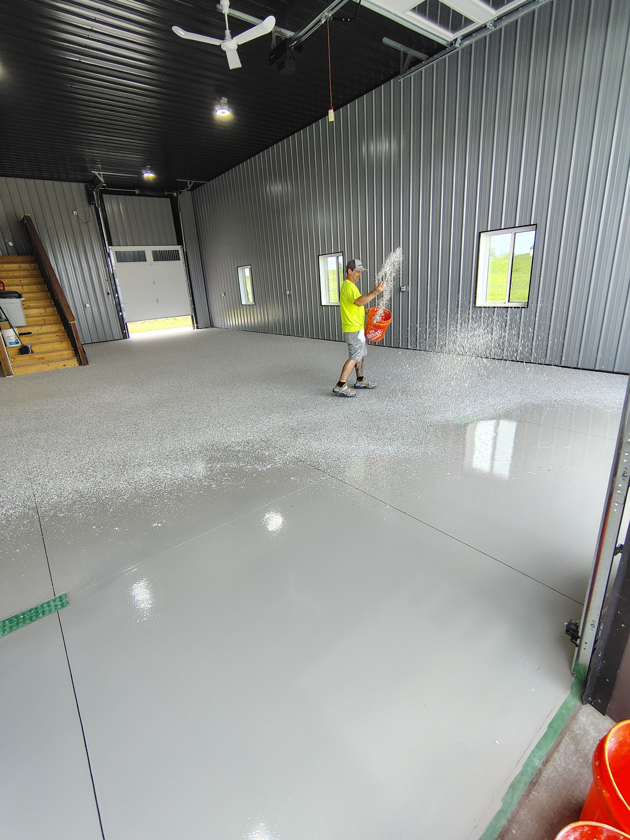 Polyaspartic Garage Floor Coating with Decorative Flake in Wentworth by Select Painting, Coatings & Garage Cabinets