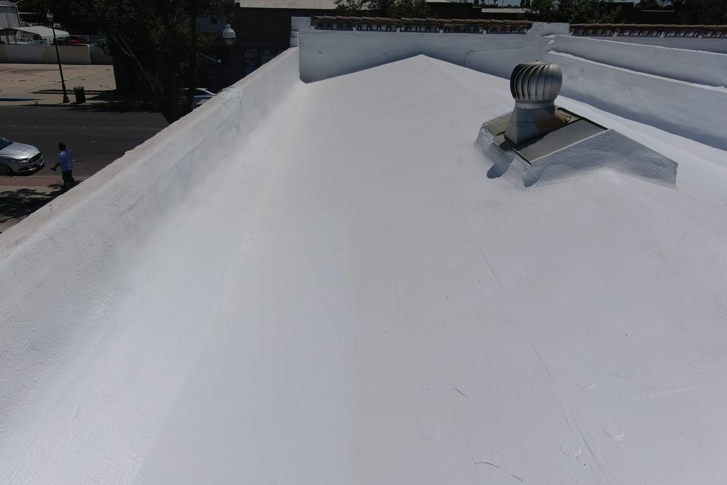 Commercial Roofing Installation using Conklin BenchPly system with PUMA top coat (imbedded fabric system) by Straight Edge Roofing Inc