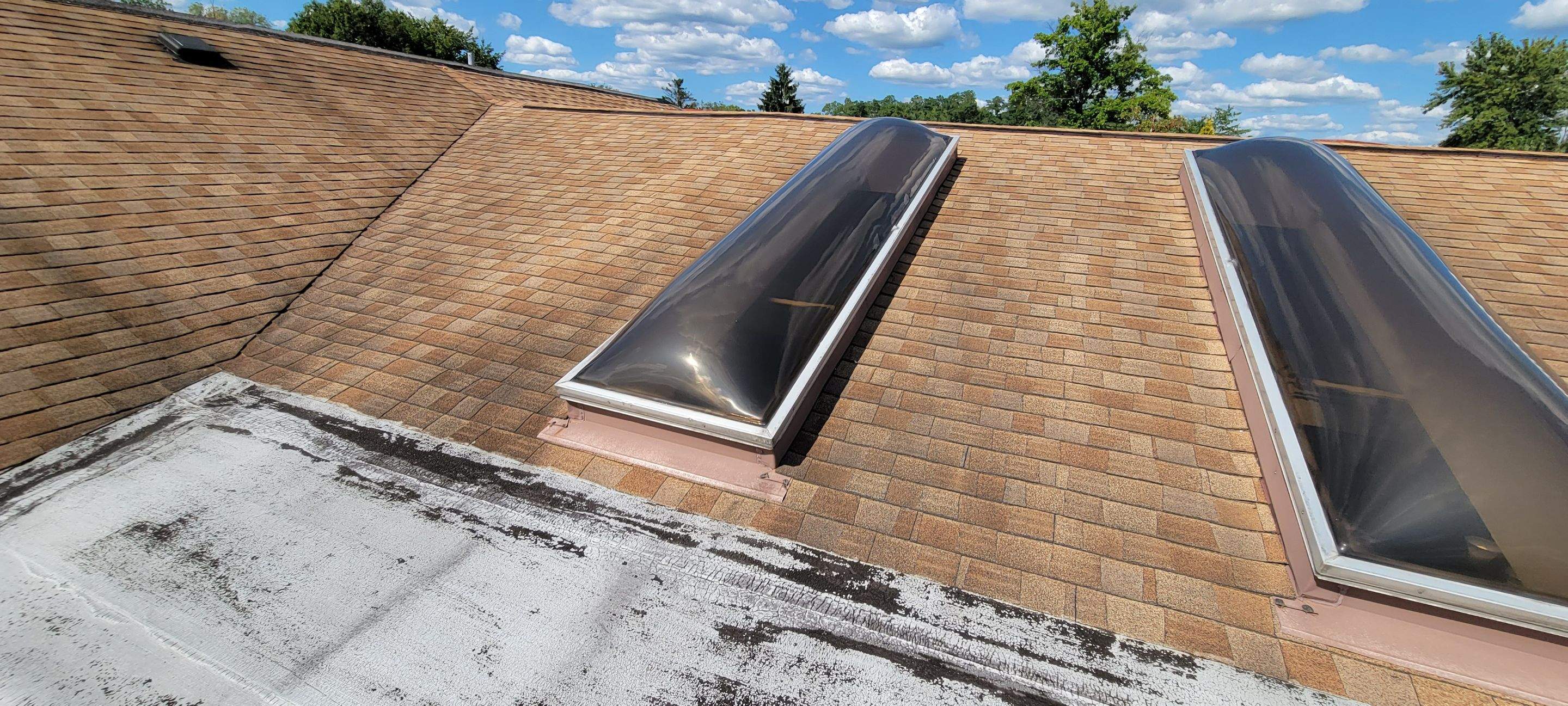 Skylight removal and install  by Absolute Roofing and Construction