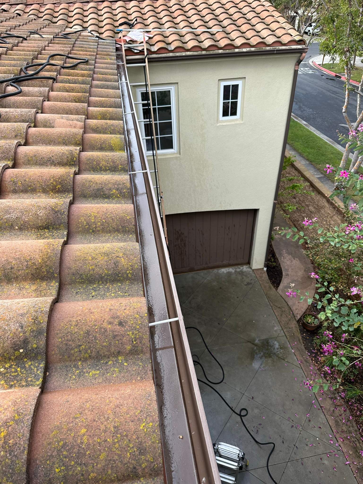 Clogged gutters at this Irvine home in Woodbury by Property Cleaning Experts, LLC