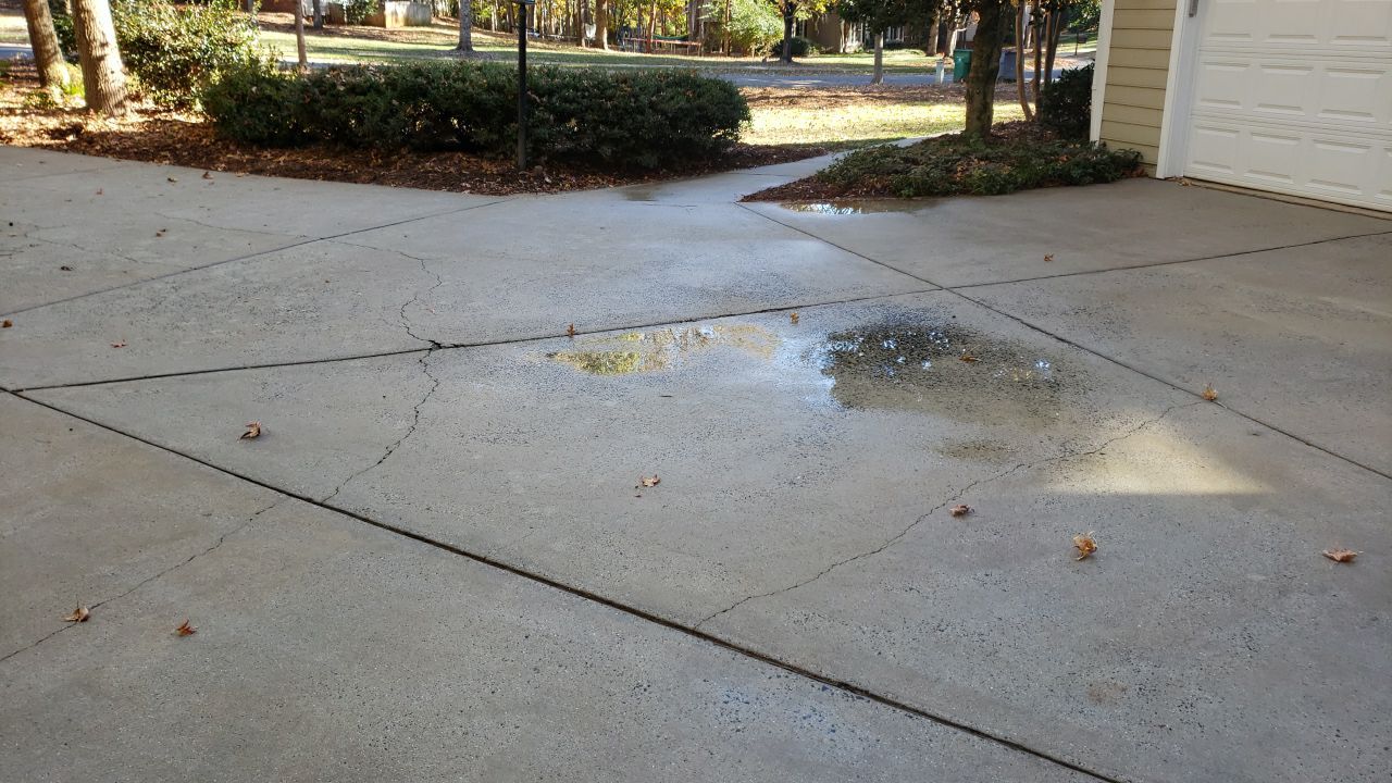 Driveway Clean using cleaner by Power Wash Masters LLC