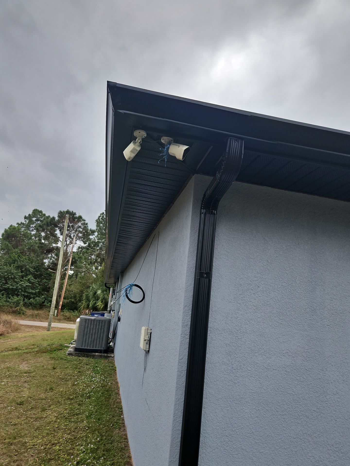 Black Seamless Gutters & Soffit/Fascia in Lehigh Acres FL by Gutter Professors