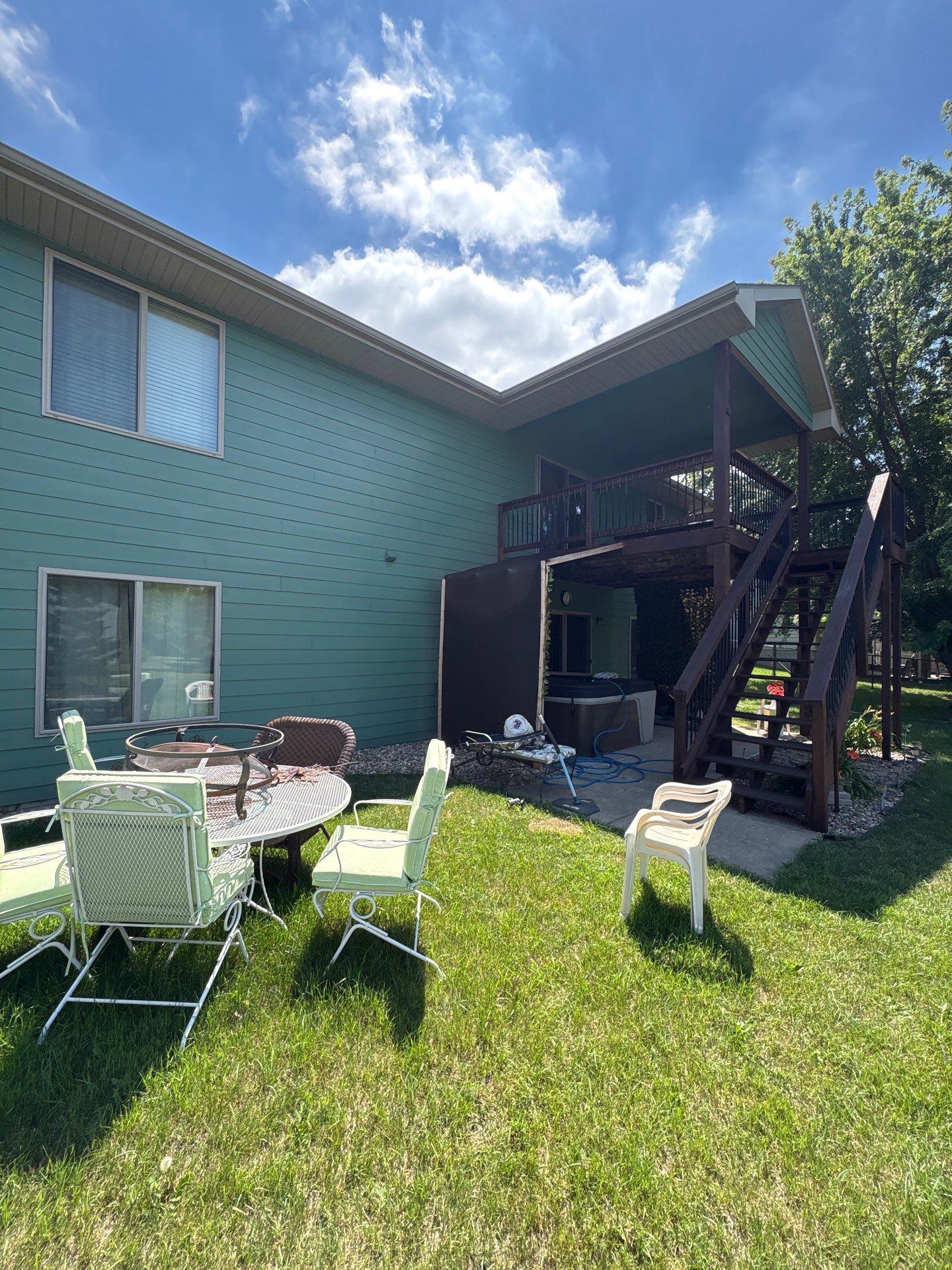 Full Exterior Residential Painting and Siding Refresh in Tea by Select Painting, Coatings & Garage Cabinets