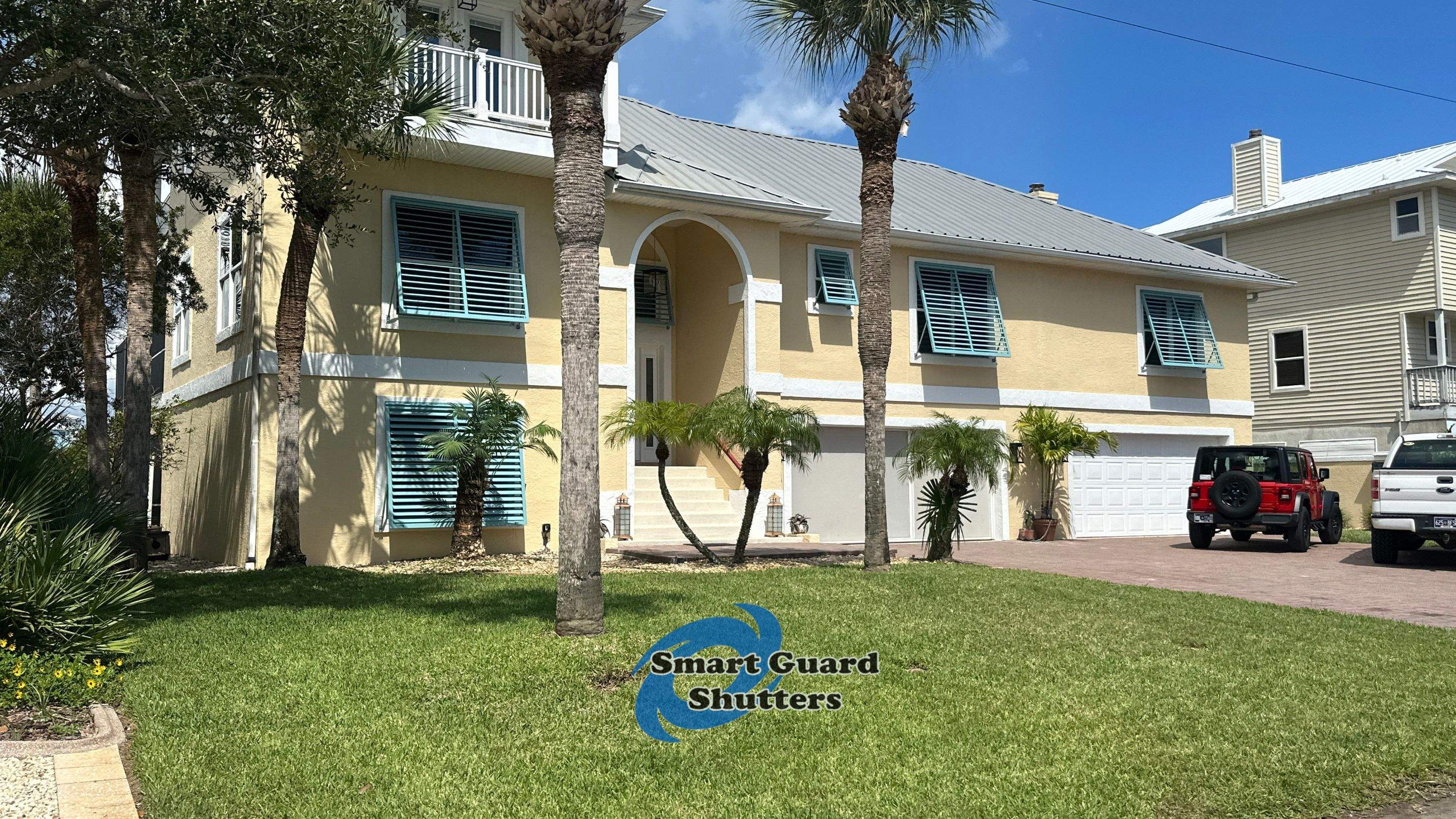 Impact Bahama Shutters in Pastel Turquoise by Smart Guard Shutters