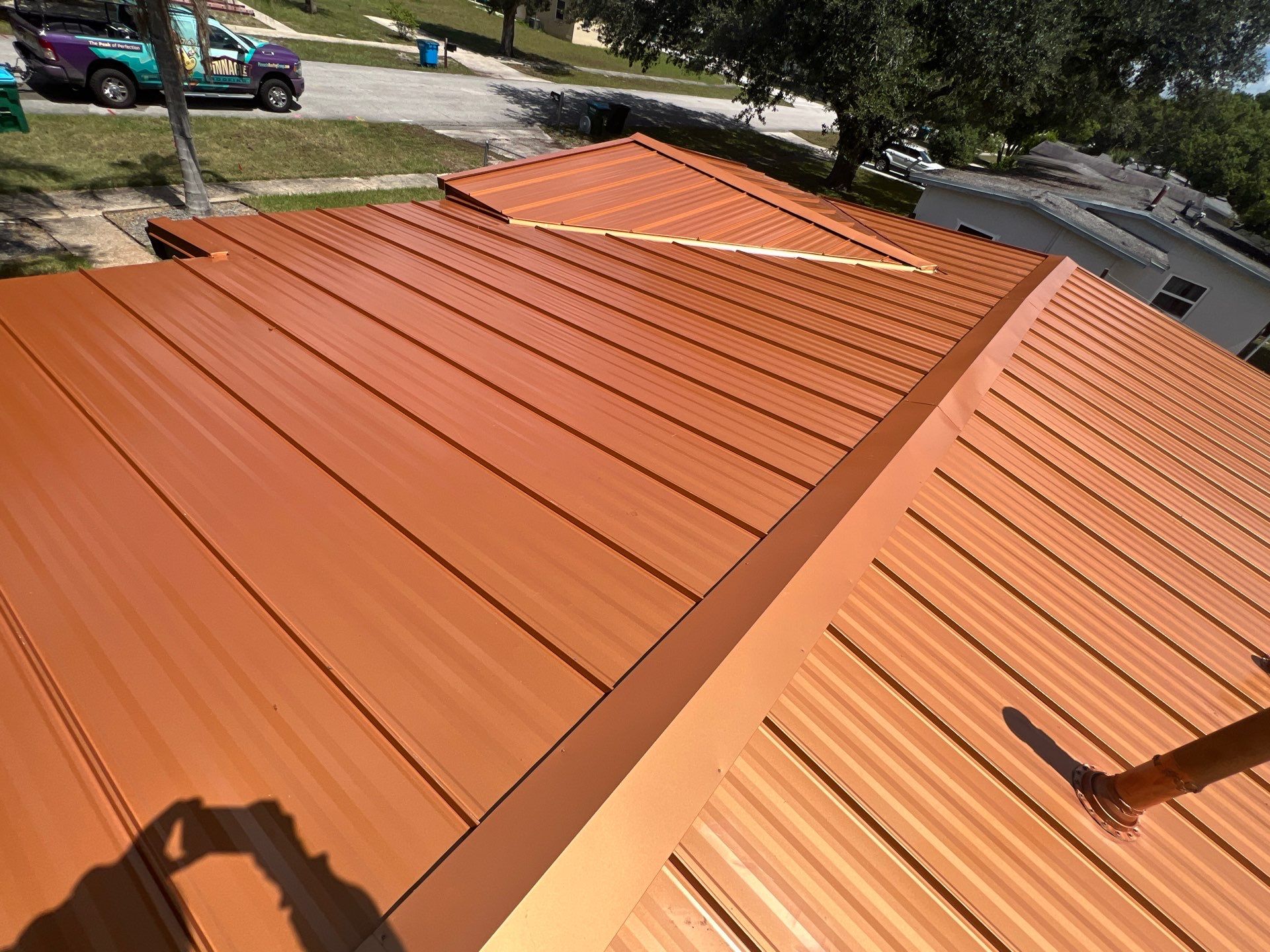 Standing Seam Metallic Copper Metal Roof Replacement in Deltona by Pinnacle Roofing Group