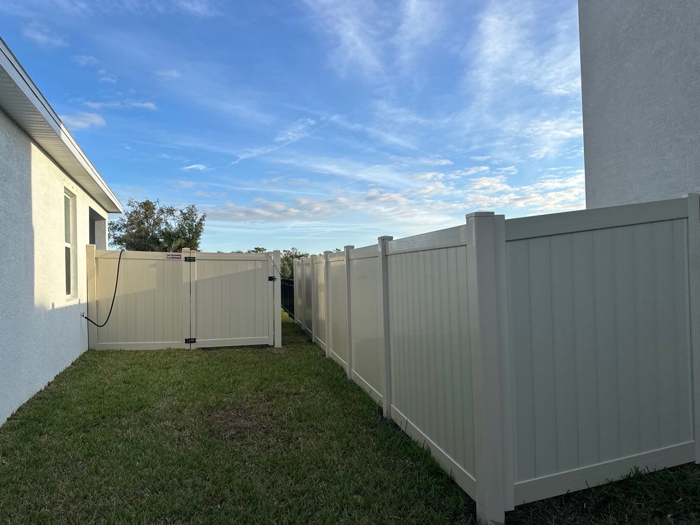 Vinyl Fence Installation using Vinyl Fence and a Black 3 Rail Aluminum Fence by Asap fence and gates, LLC