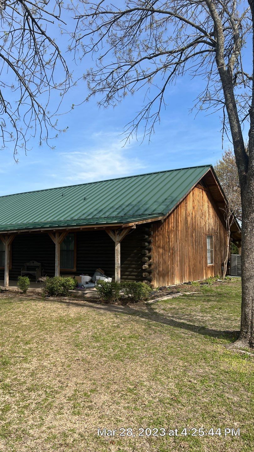 Shingle to Standing Seam Metal Roof by Springtree Restoration