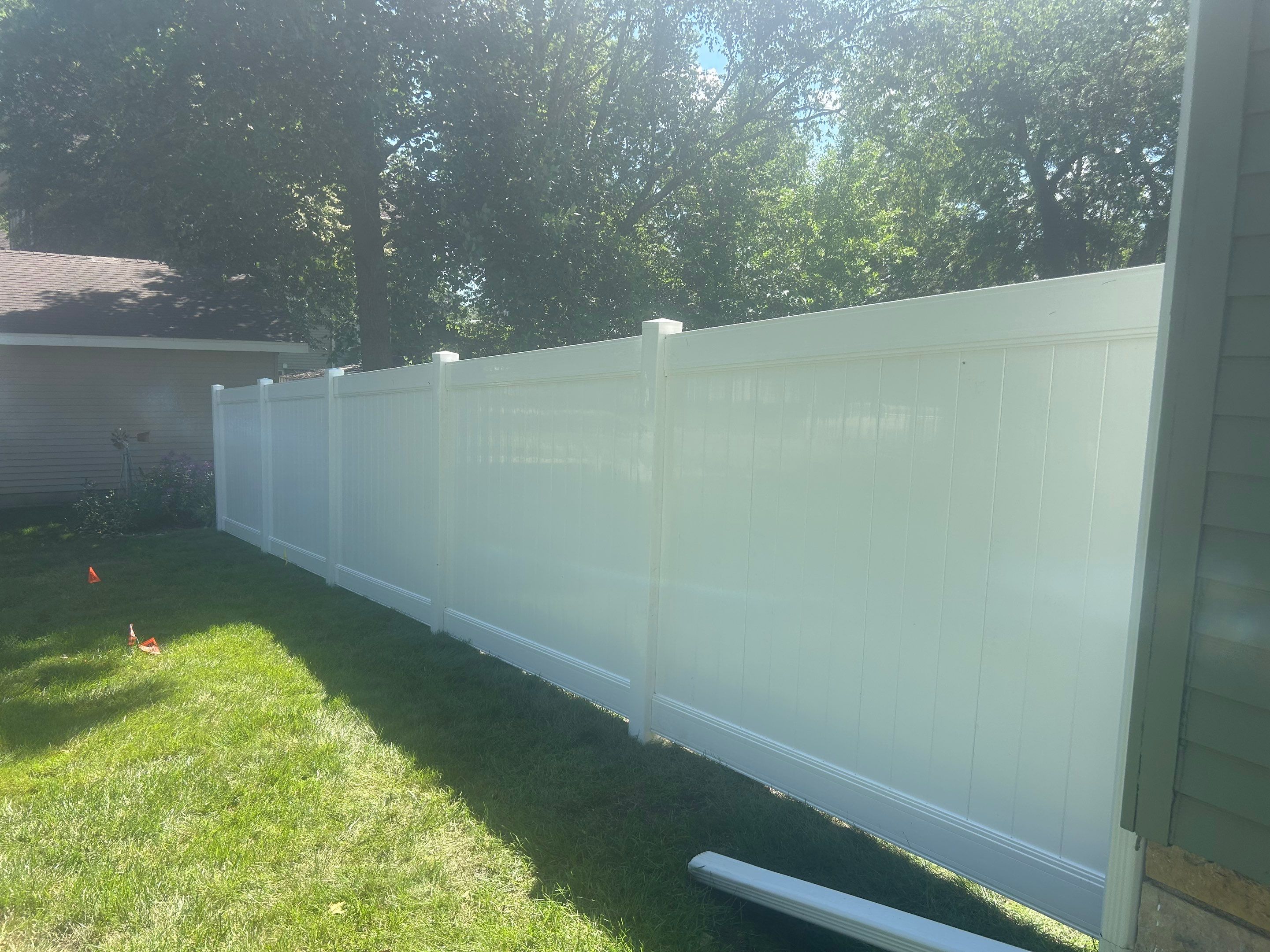 White Vinyl Privacy Fence Installation in Aplington, Iowa by Perfect Picket Fence and Stain