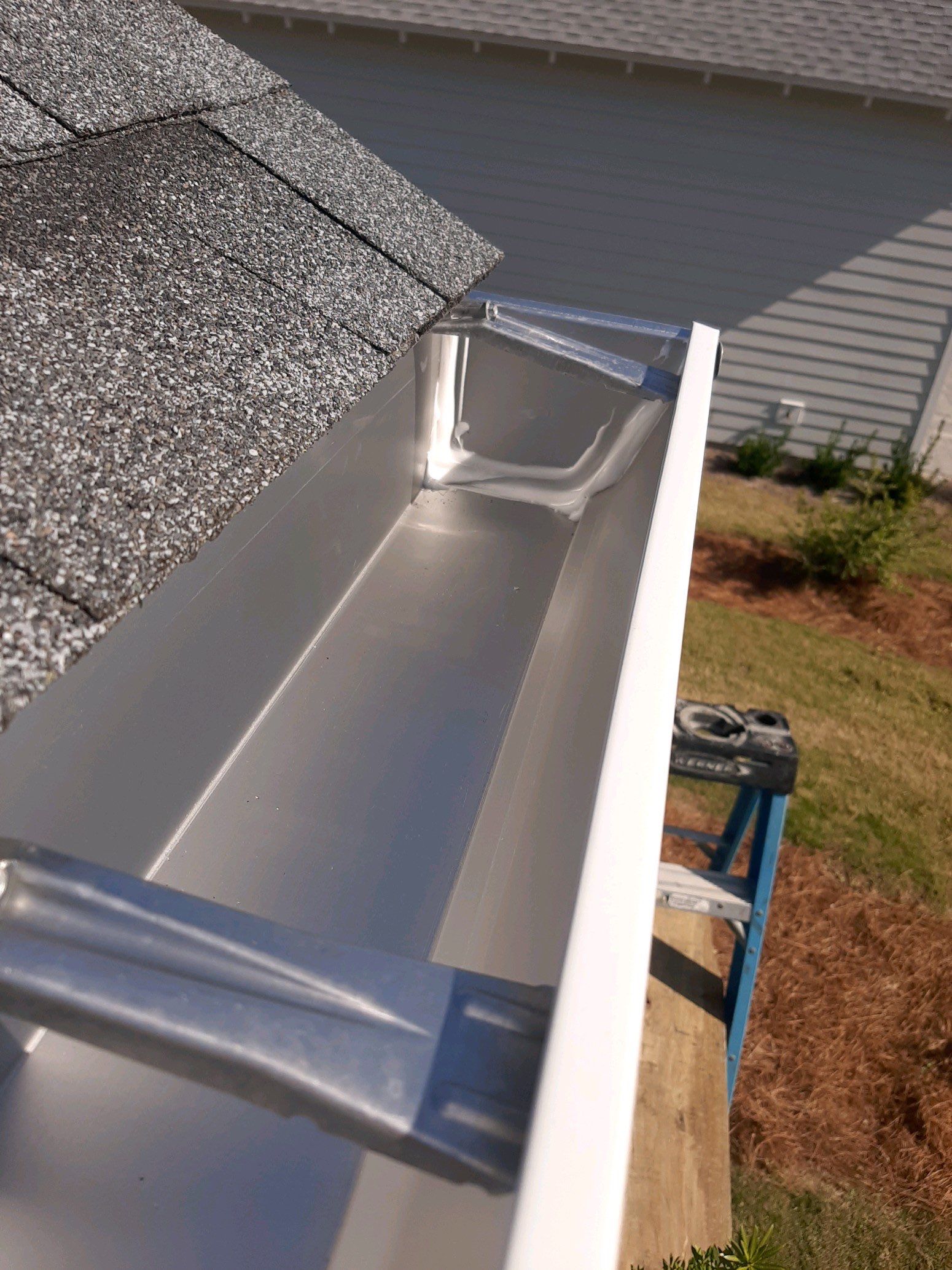 Gutter Installation Using White K-Style Aluminum Seamless Gutters by Gutter Professors