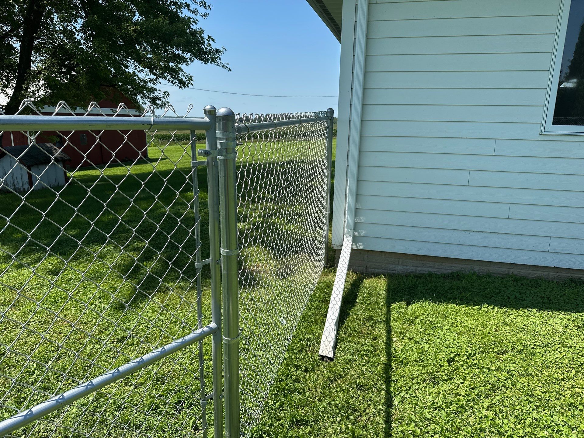 Residential Galvanized Chain Link Perimeter Fence Installation in New Hartford by Perfect Picket Fence and Stain