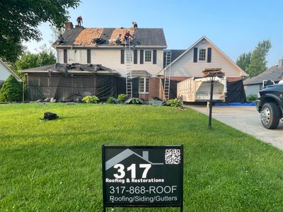 Tornado damage in Whiteland. Roof replacement, James Hardie siding, exterior paint, gutters, windows, doors