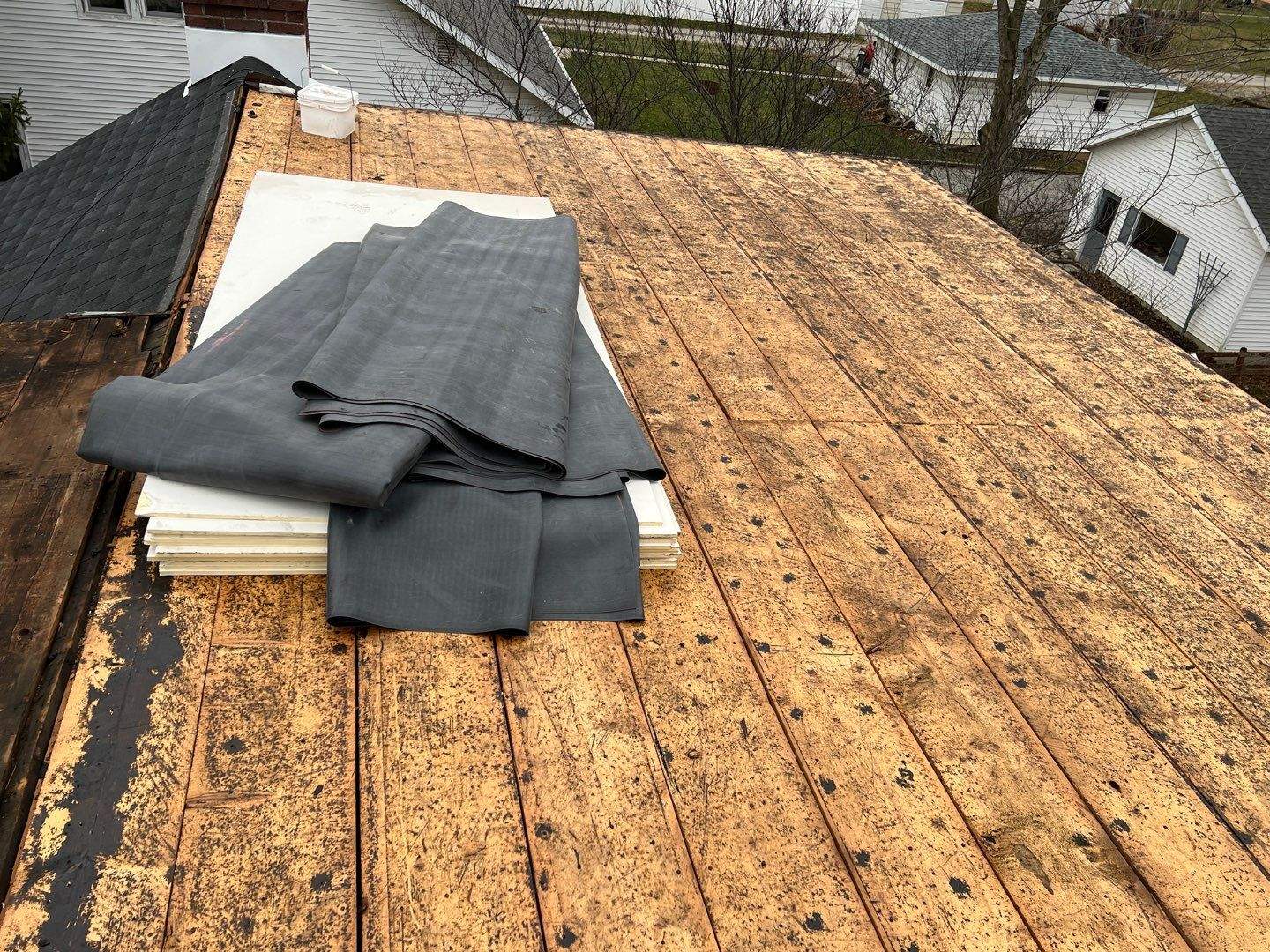 Residential Roofing Installation using 60 mil rubber roof by Nitro Roofing and Construction