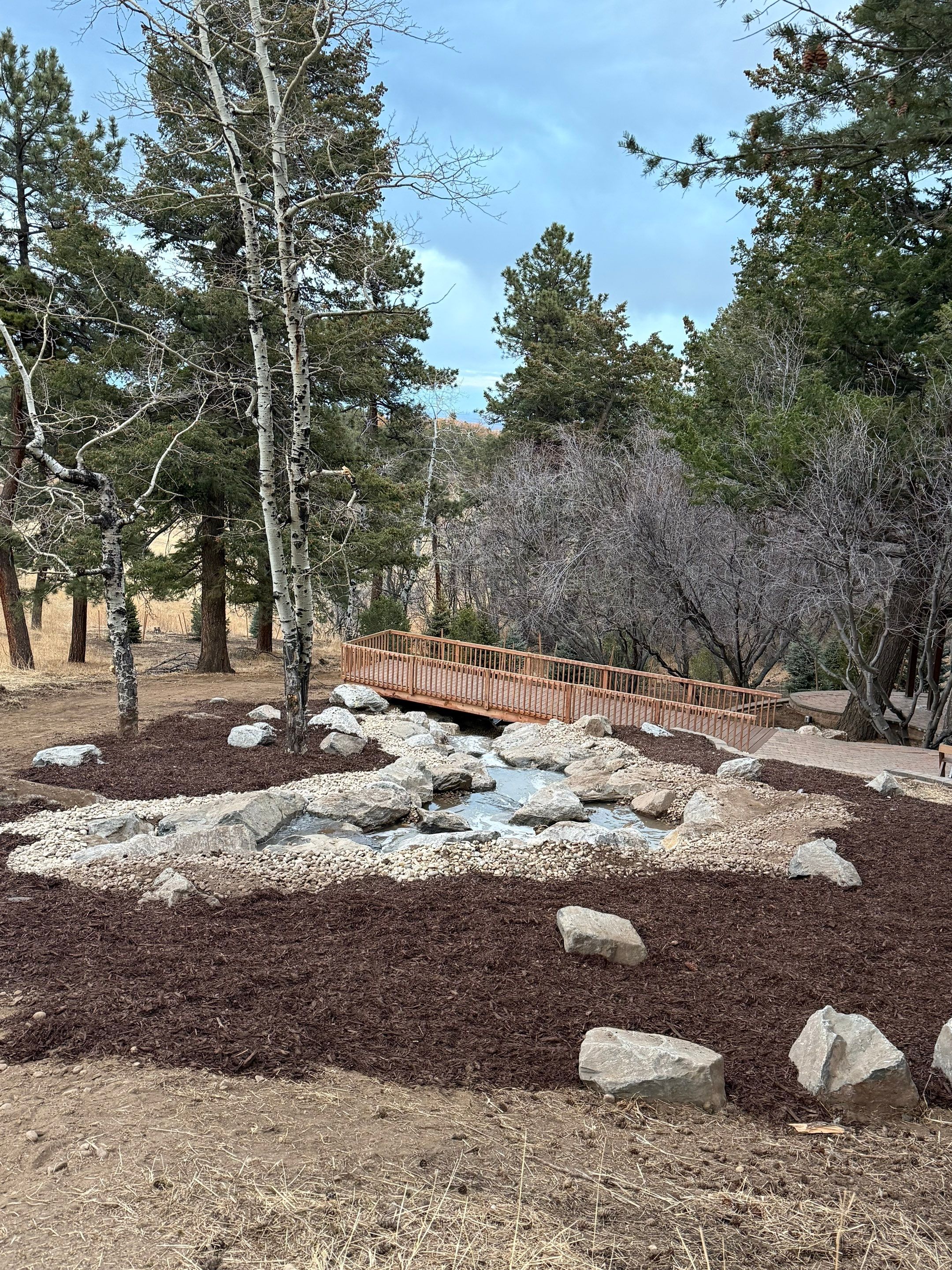 large waterfall and deck by JRM landscape & design