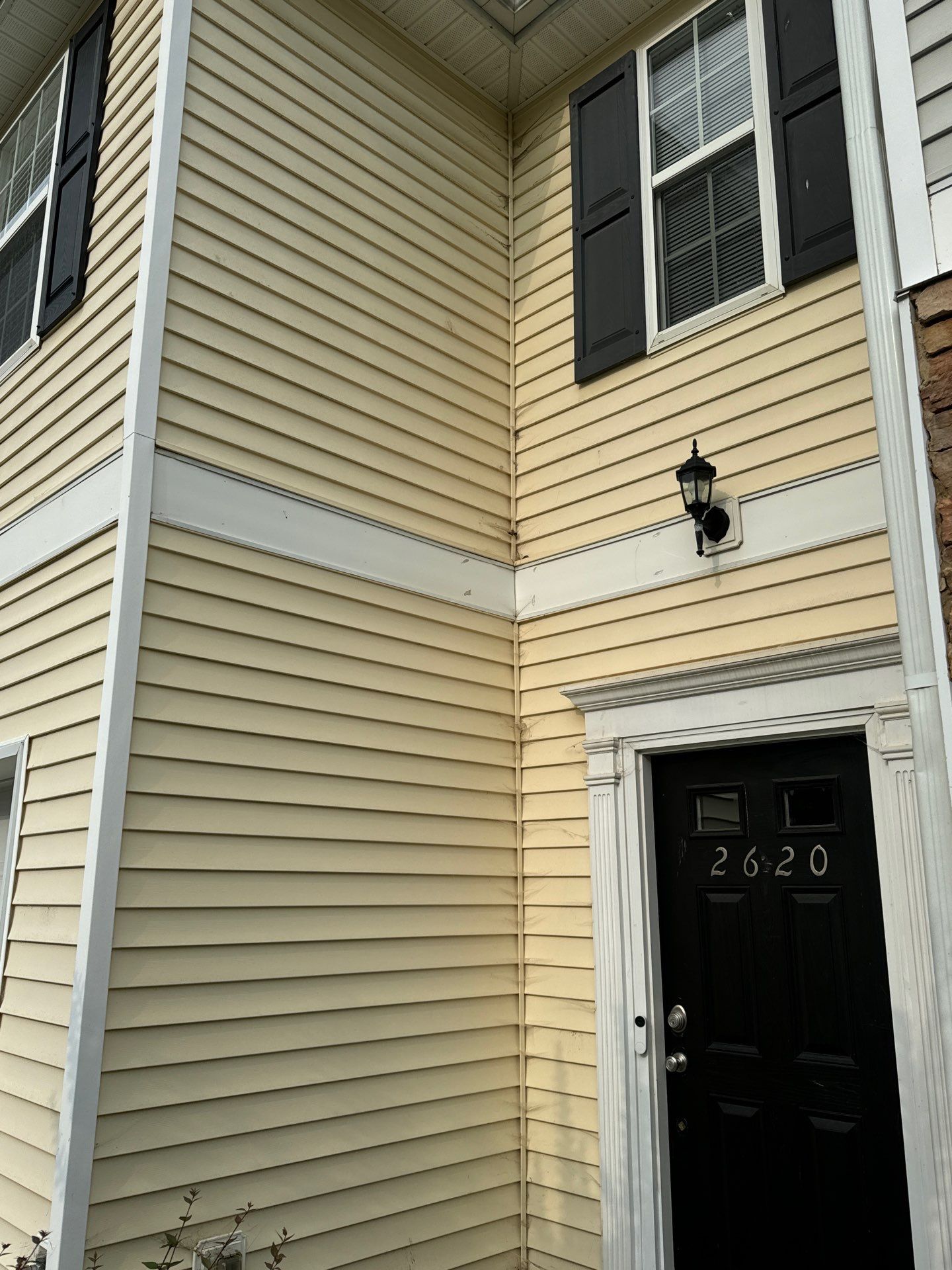 pressure washing exterior siding to remove dirt and stains restoring appearance