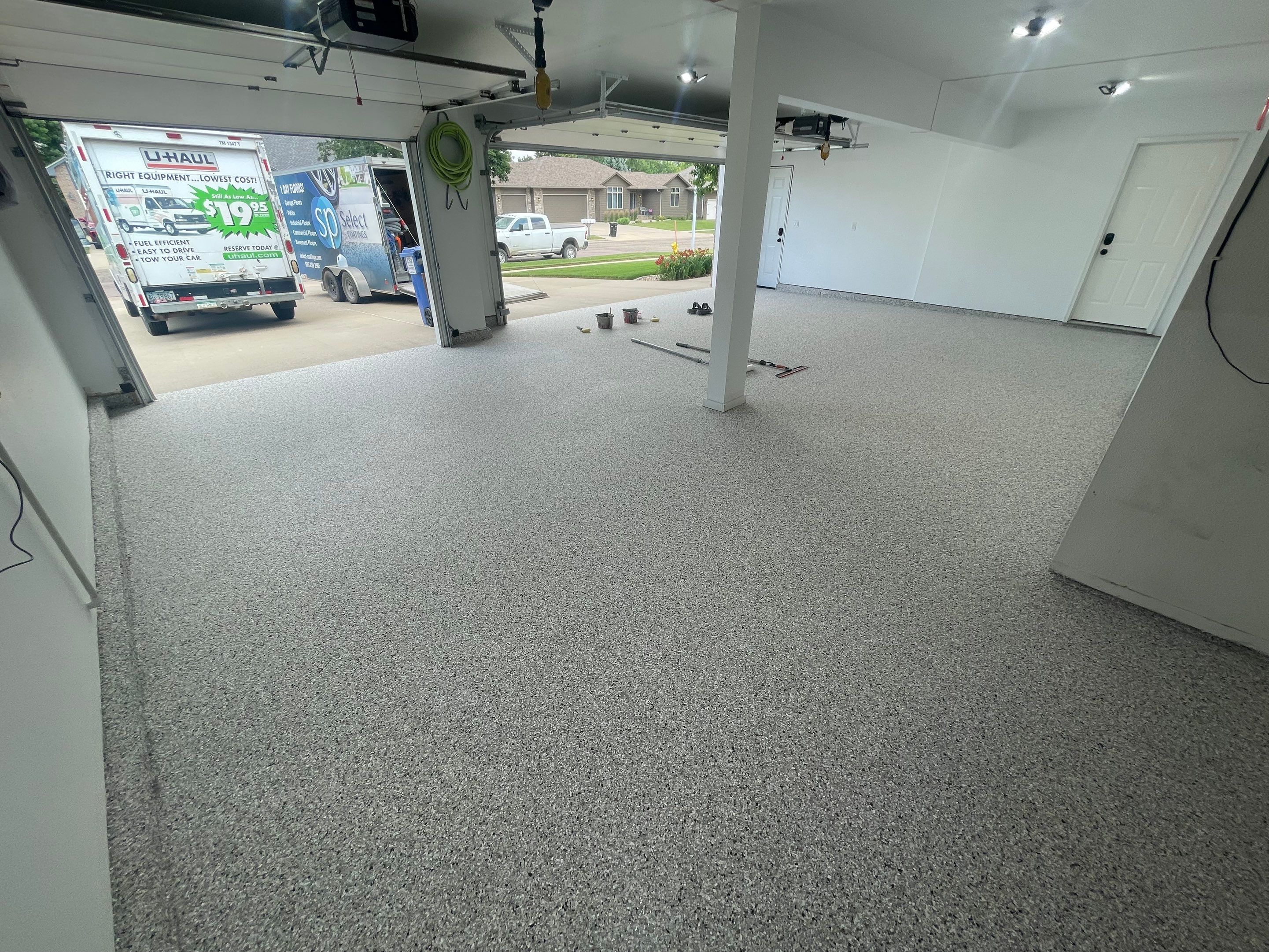 Multi-Car Garage Concrete Coating with Coyote Flake Finish in Sioux Falls by Select Painting, Coatings & Garage Cabinets