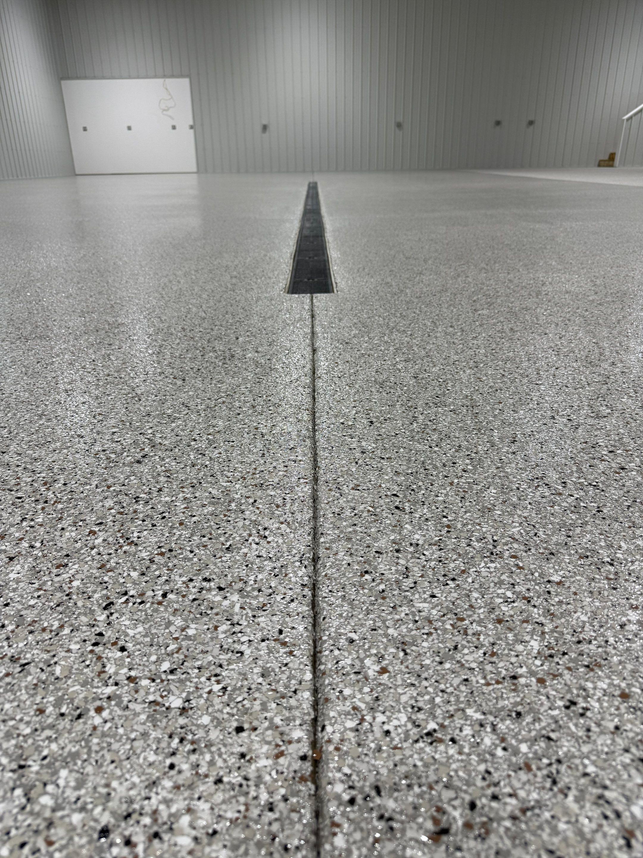 Custom Speckled Floor Coating for Large Montrose Shop by Select Painting, Coatings & Garage Cabinets