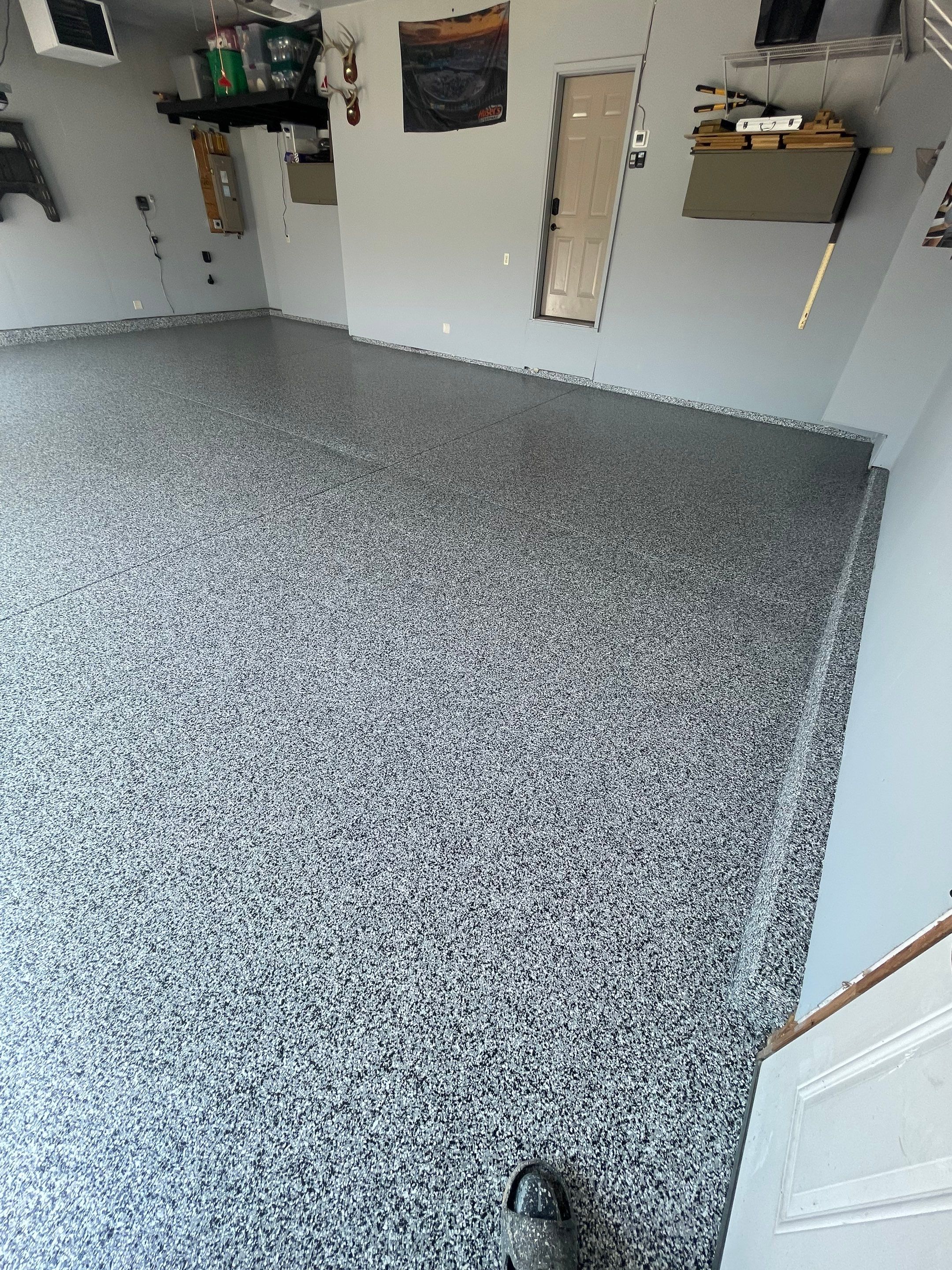 Sioux Falls Garage Concrete Coating Installation with Domino Flake by Select Painting, Coatings & Garage Cabinets