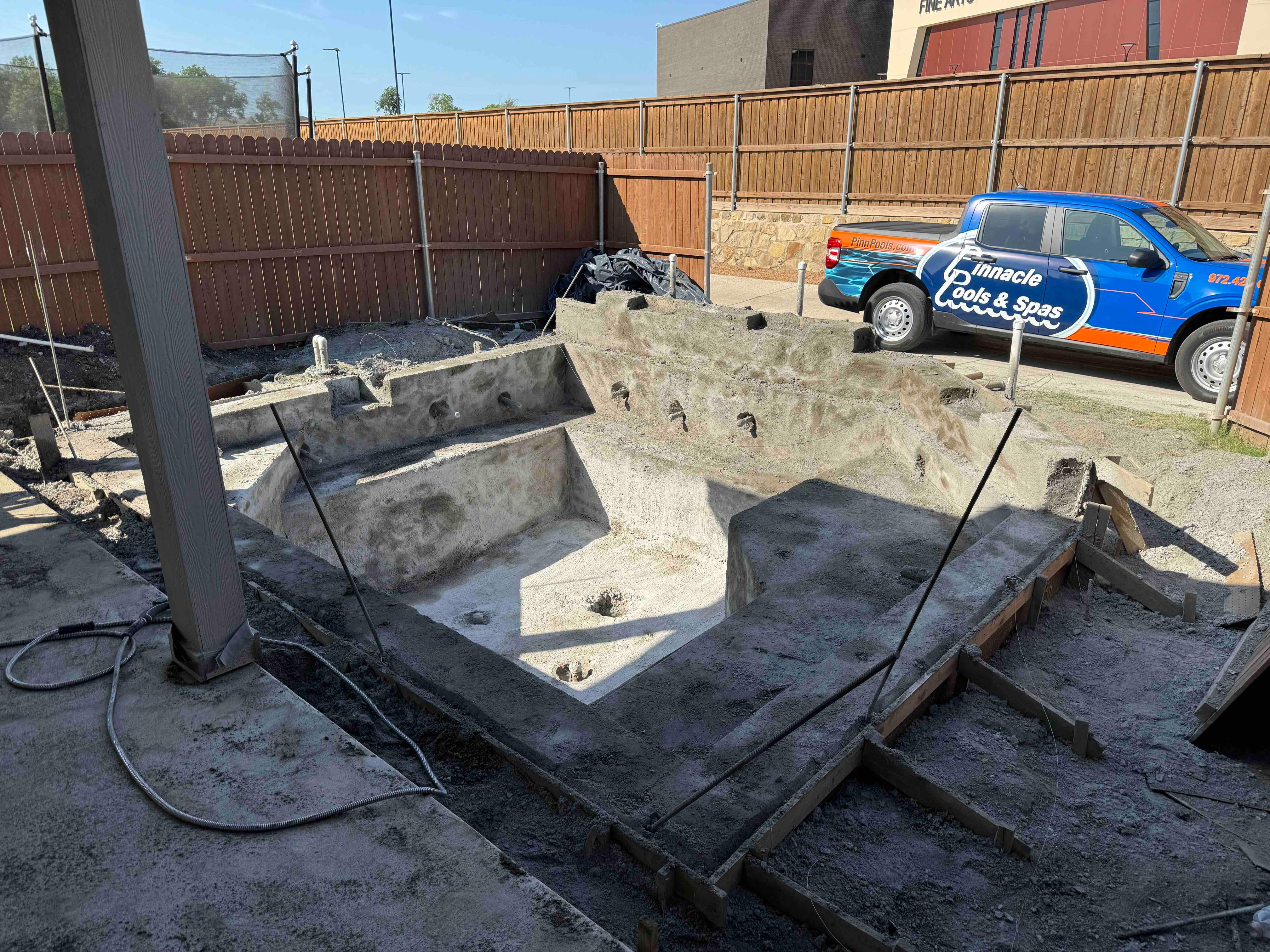 Geometric Pool with Raised Spa and Tanning Ledge by Pinnacle Pools and Spas - DFW