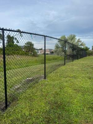 Black Vinyl-Coated Chain Link Fence and Gate Installation in North Port