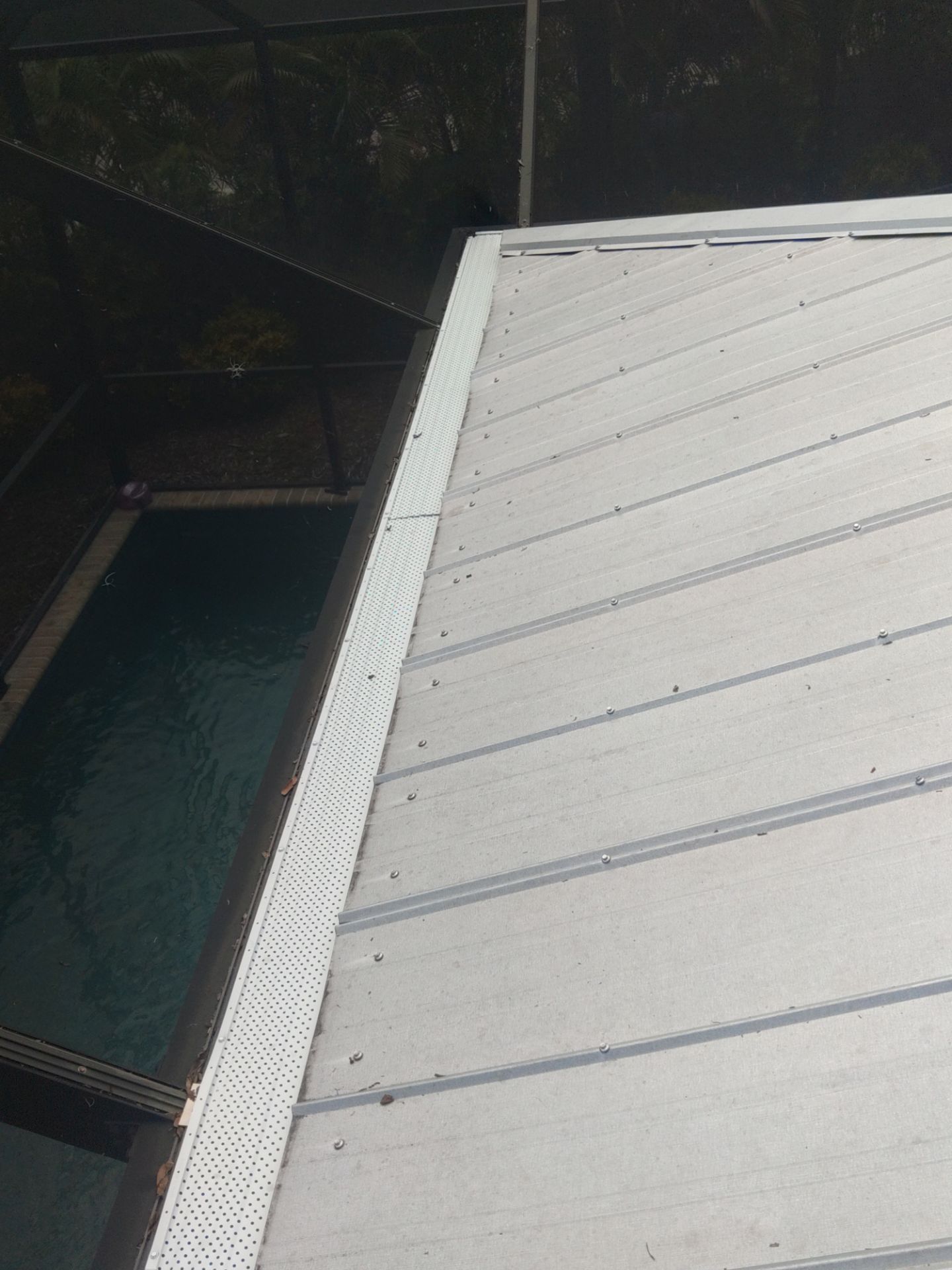 Gutter guards installation combined with gutter cleaning in Sarasota, FL by Gutter Professors