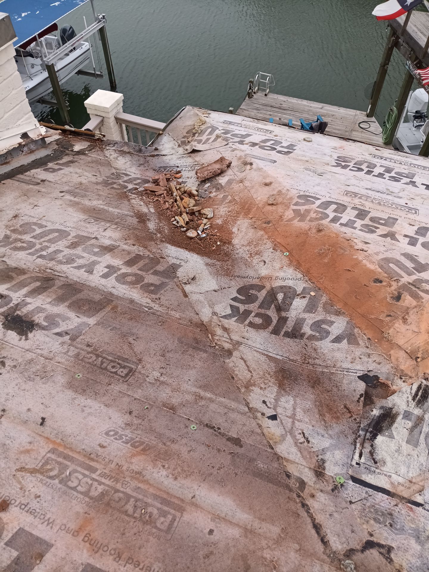 Off with the Tile and on with the TILCOR stone coated metal.  by Bayfront Roofing and Construction
